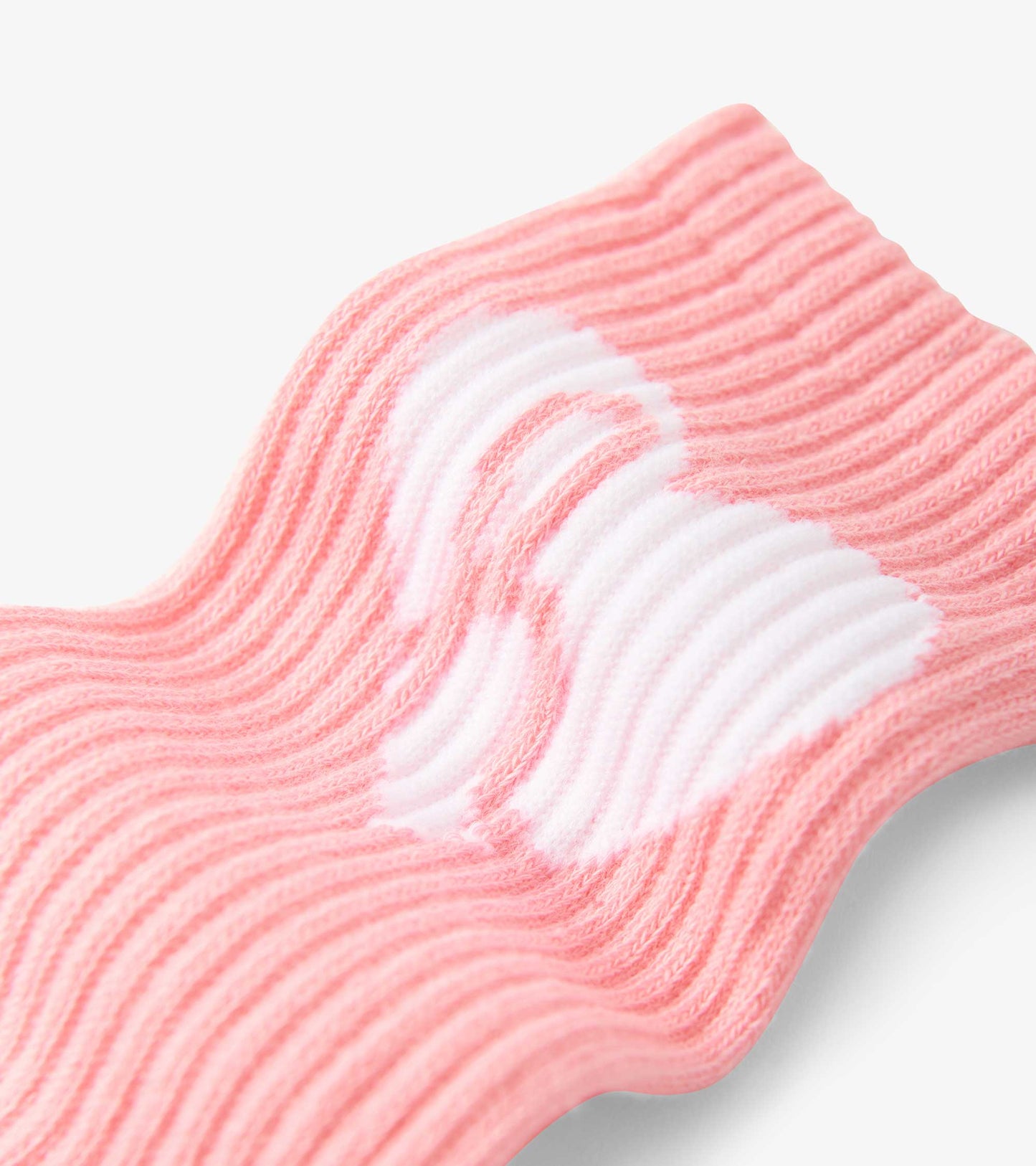 Pink ribbed tube socks with white heart pattern, suitable for kids aged 2-12.