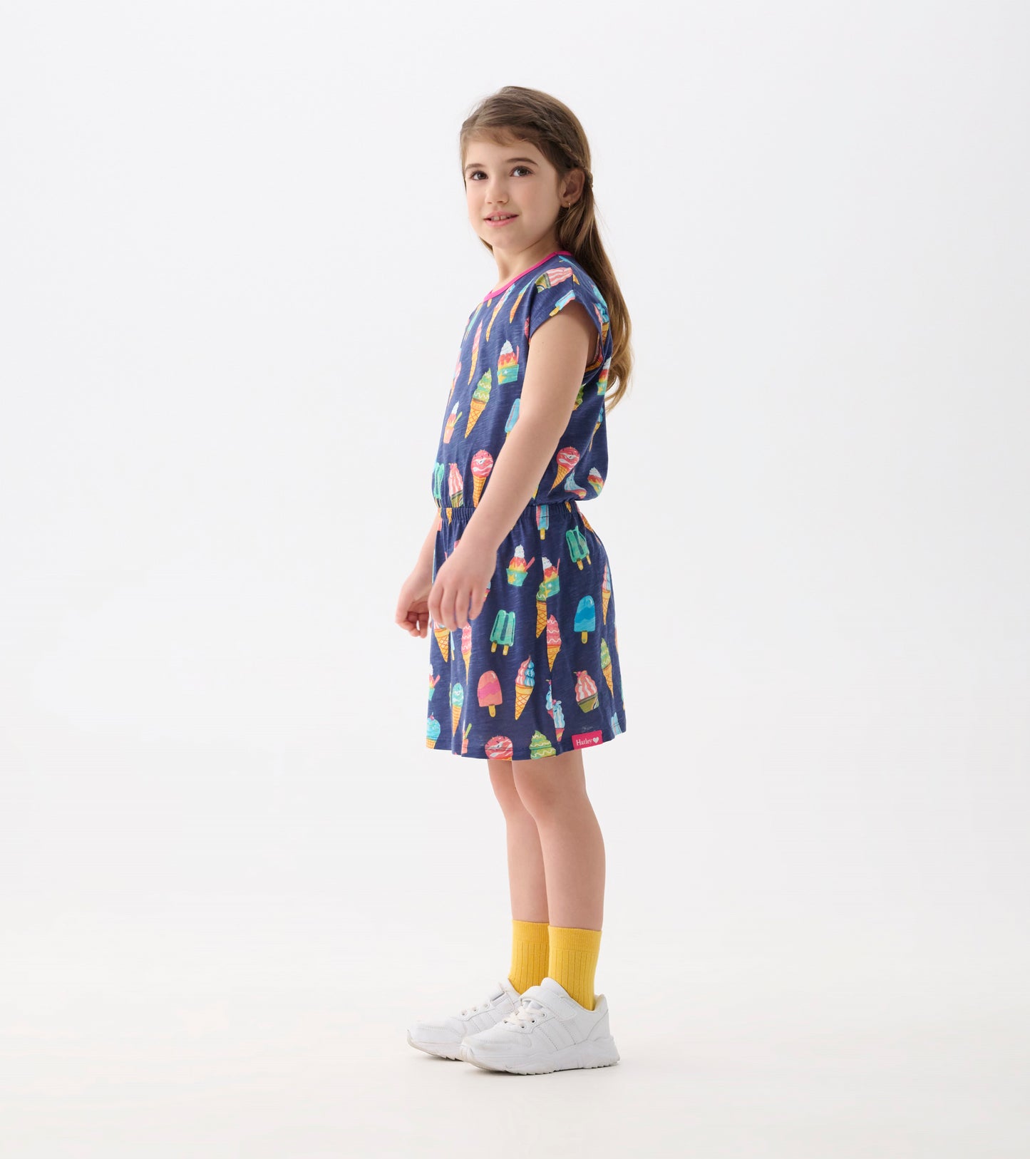 Navy dress with colorful ice cream cone pattern, short sleeves, elastic waist, and a relaxed fit.