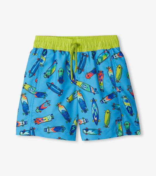 Blue swim trunks featuring a colorful skateboard pattern and an elastic waistband with a drawstring.