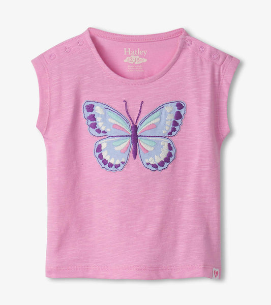Pink short-sleeve shirt featuring an embroidered butterfly design on the front, with snap buttons on the shoulder.