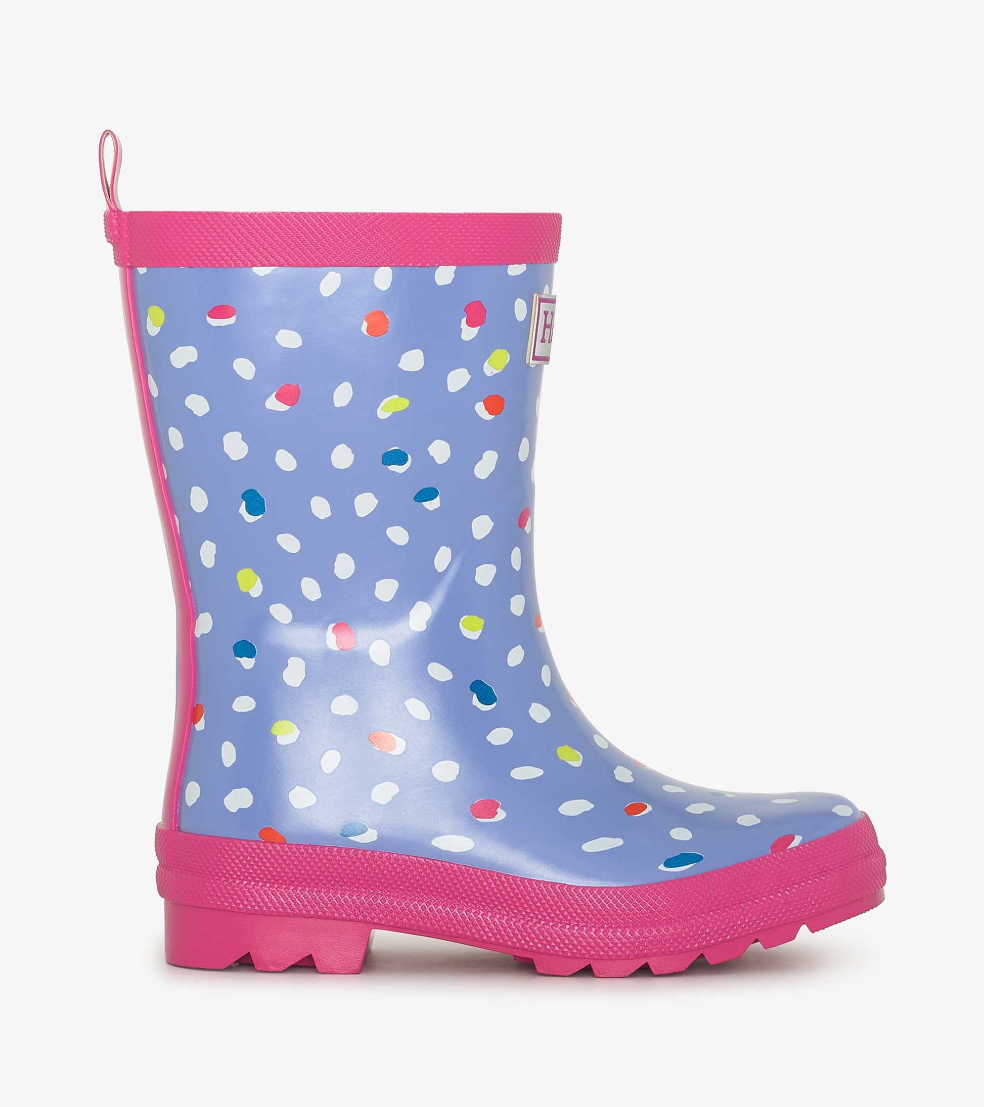 Shiny blue rain boots with colorful polka dots and a pink sole, designed for kids. Side view shows height and shape.
