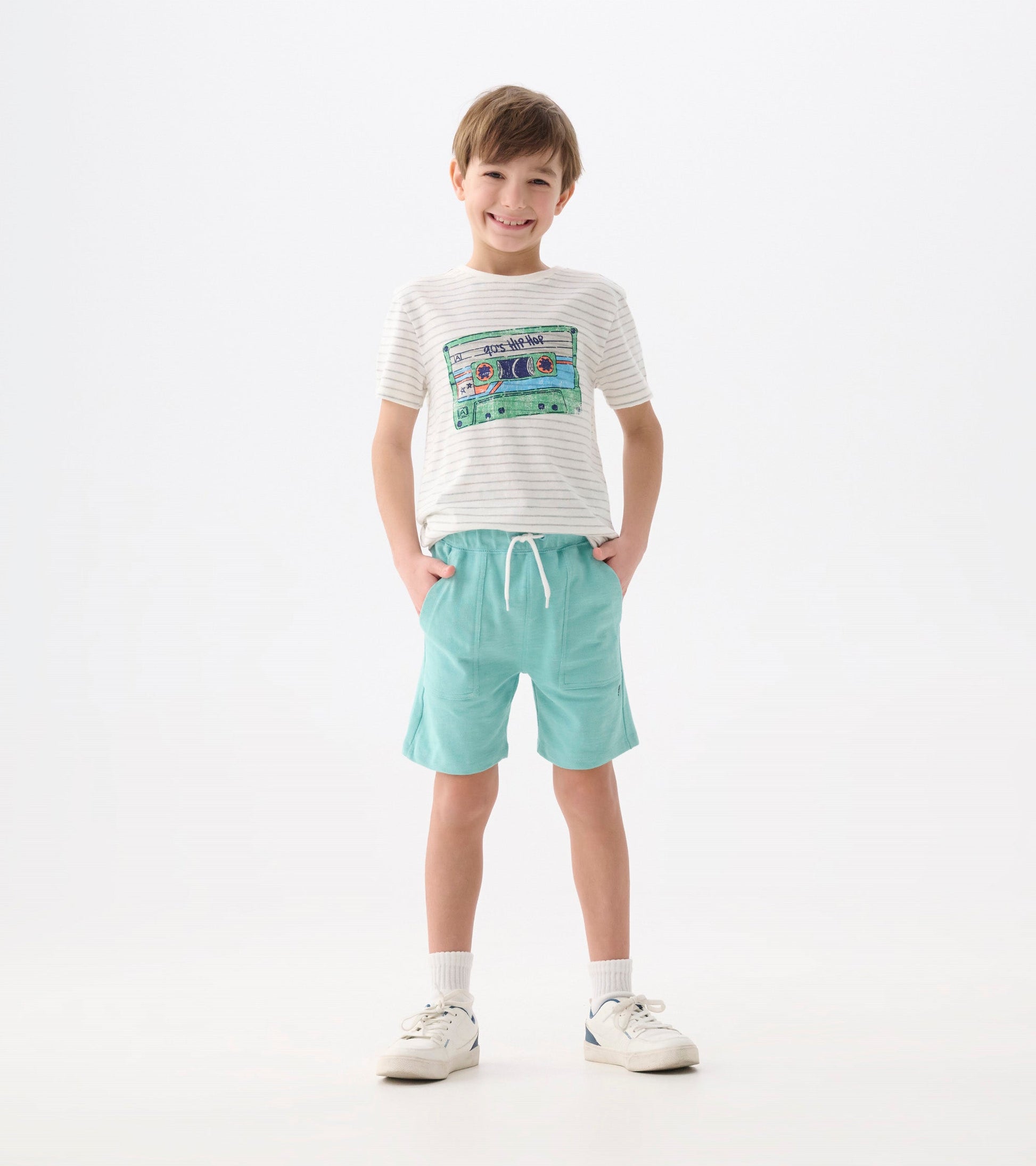 Light blue relaxed shorts with an elastic waistband and side pockets, styled for boys.