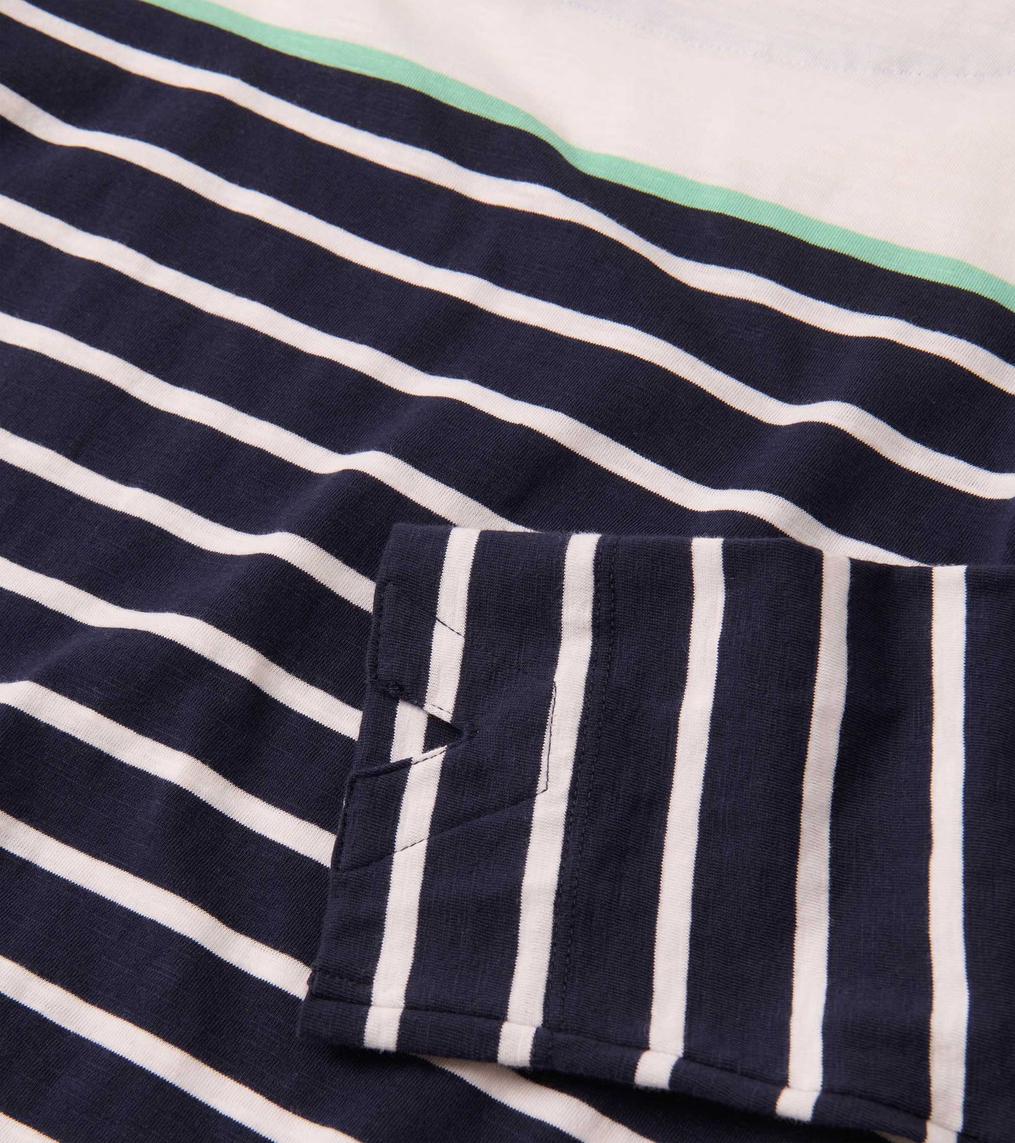 Navy and white striped fabric with a mint green accent, featuring a folded sleeve detail.