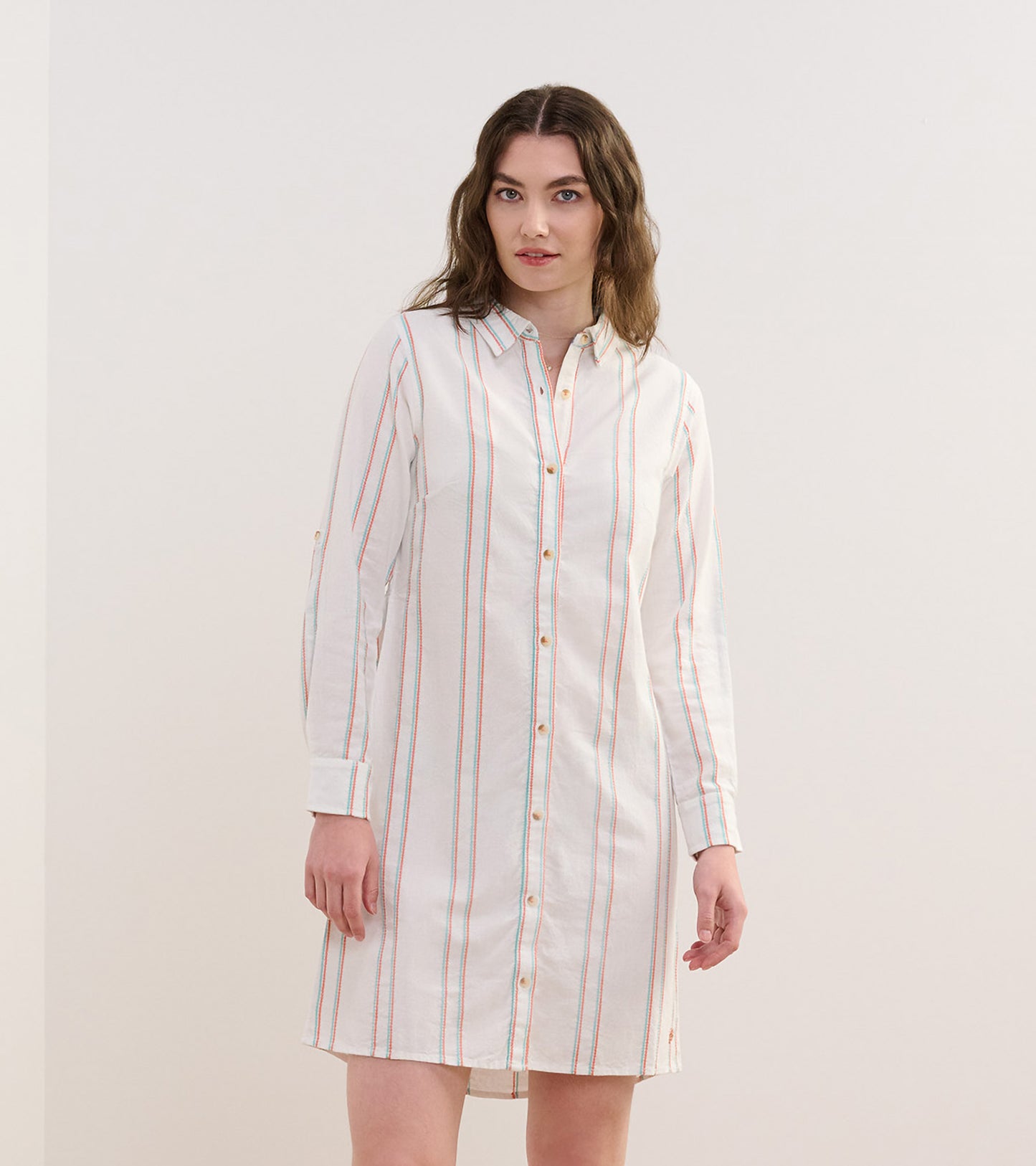 Peach chain-striped shirt dress with a button-down front and long sleeves, featuring a relaxed fit.
