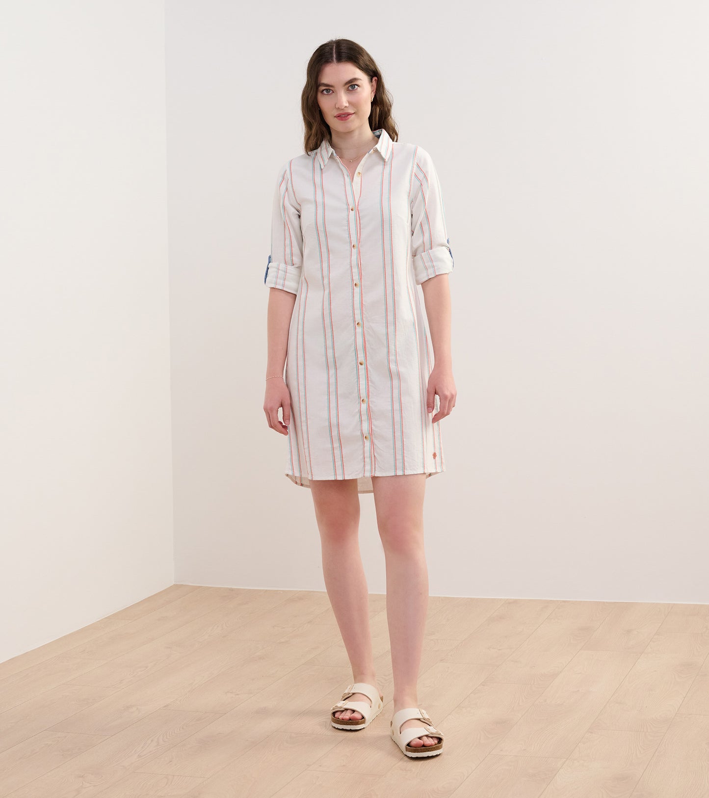 Peach chain-striped shirt dress with a button front and rolled sleeves, perfect for casual wear.