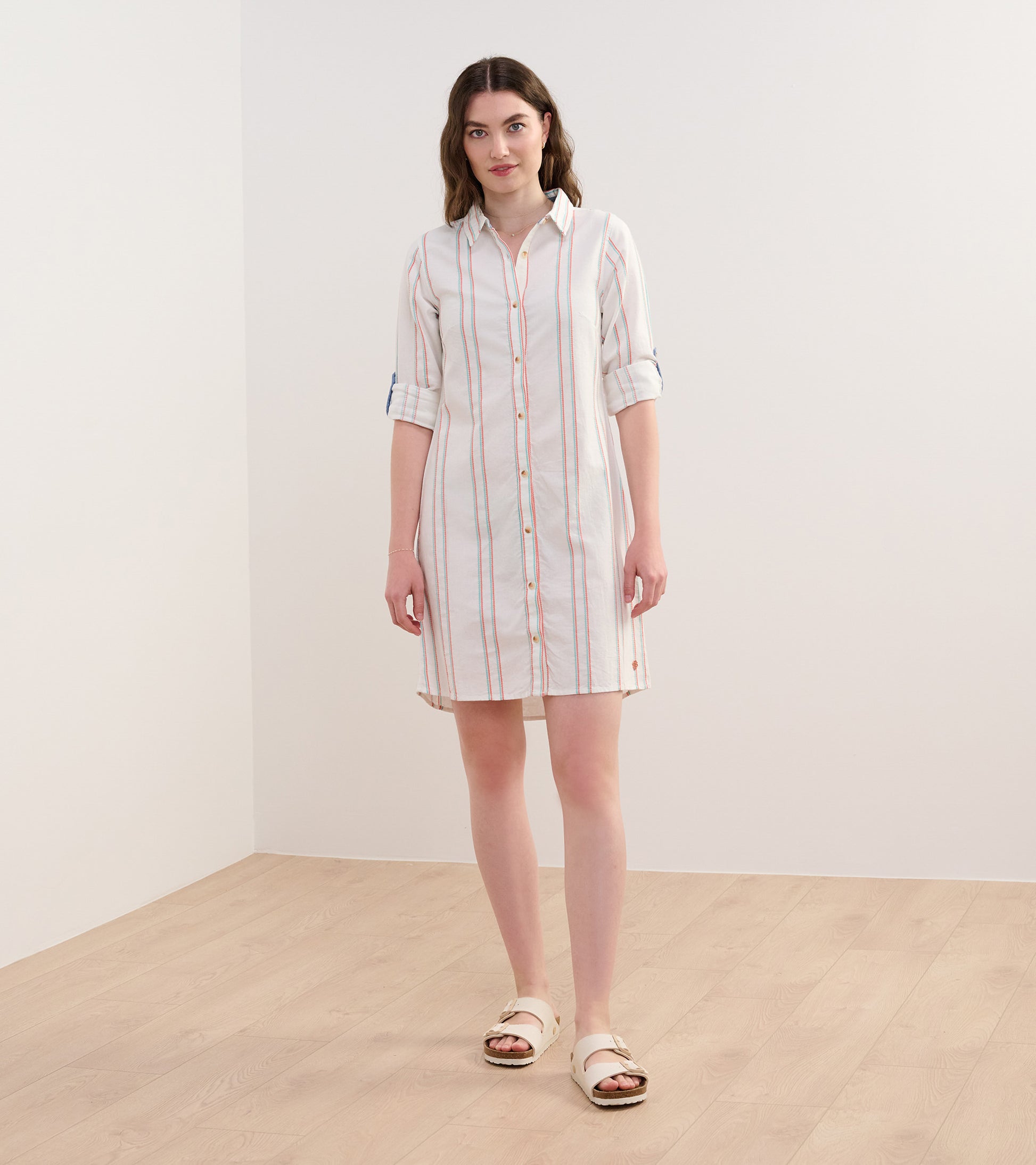 Peach chain-striped shirt dress with a button front and rolled sleeves, perfect for casual wear.