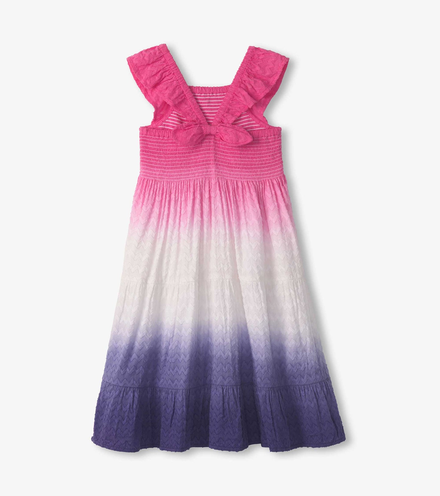 Purple dip dye smocked dress with ruffled straps, featuring a gradient from pink to purple and a tiered hem.
