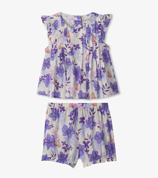 Purple floral pin tuck top with ruffled sleeves paired with matching bloomers, suitable for baby and toddler girls.