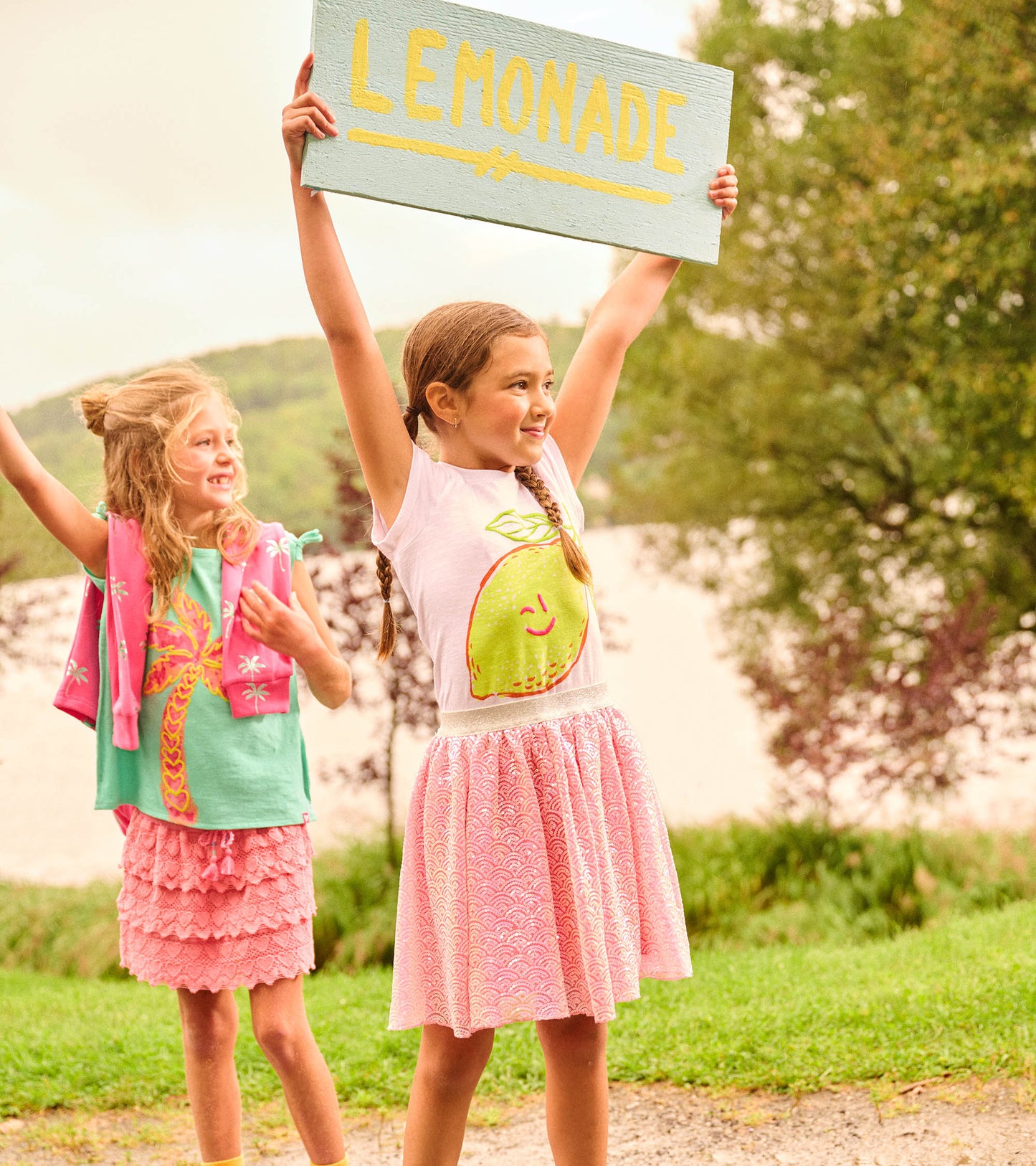 Pink tulle skirt with mermaid sequin pattern, featuring a comfortable waistband, ideal for playful summer outings.