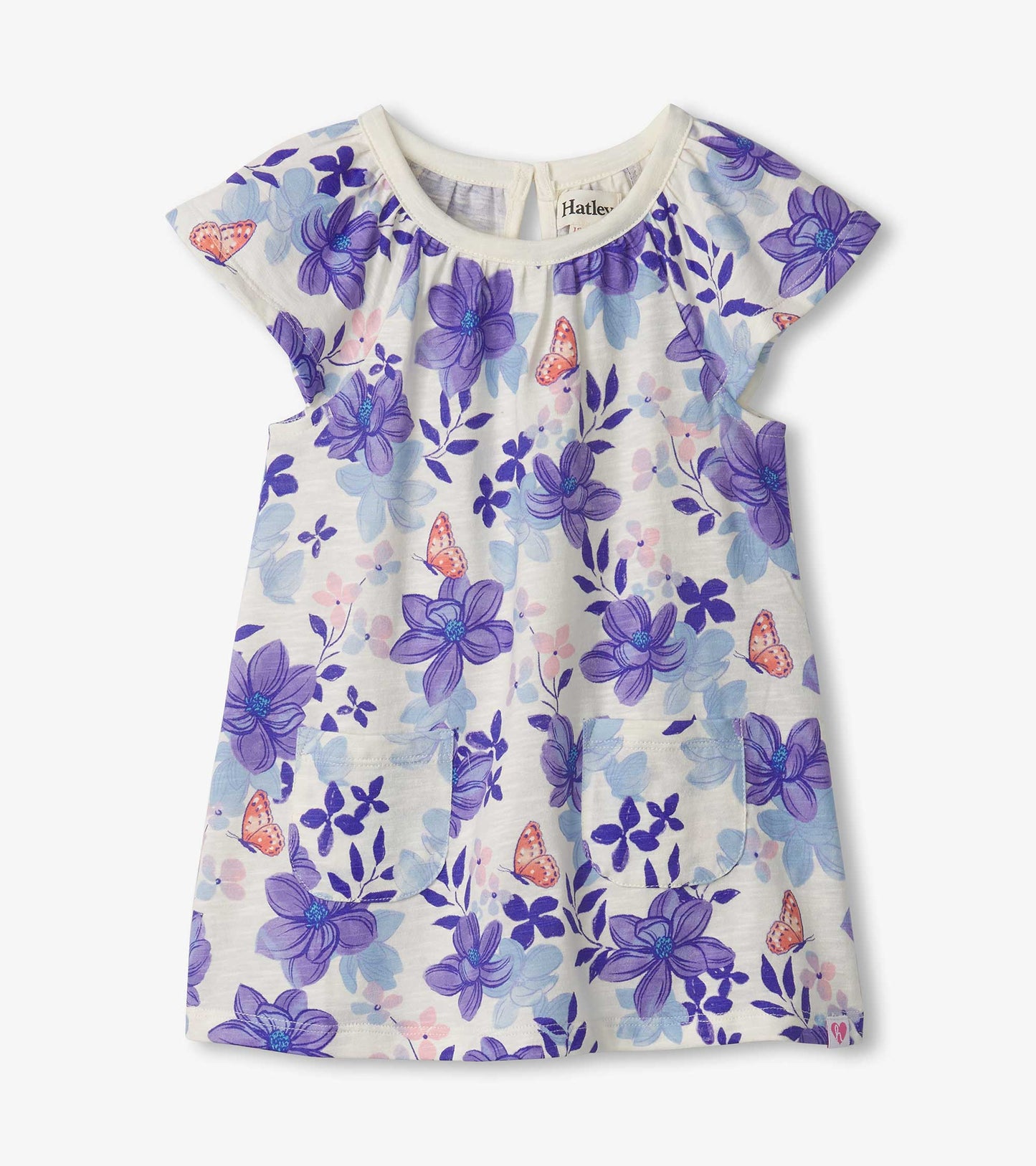 Light-colored dress featuring a floral pattern with purple magnolias and butterflies, designed for baby and toddler girls.
