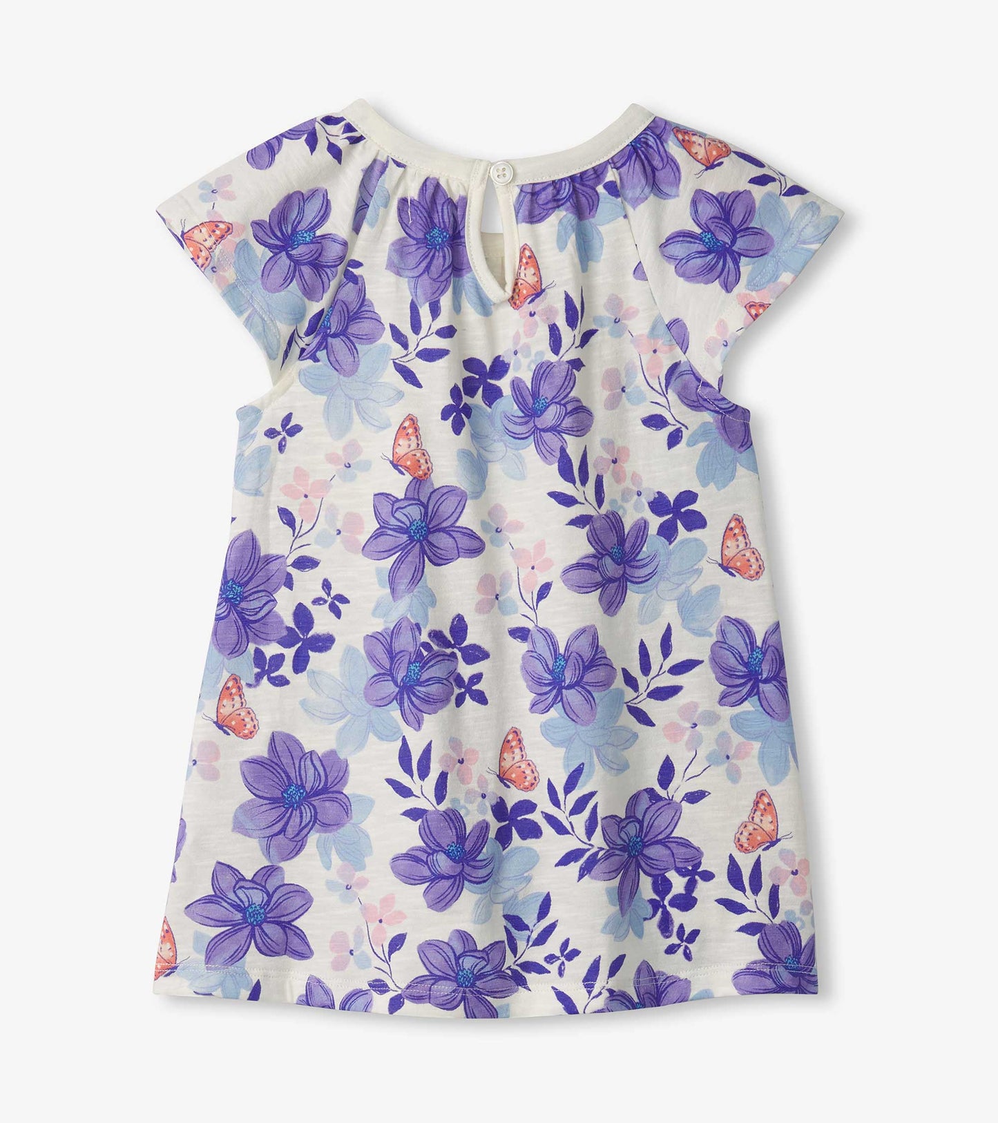 White dress featuring a floral pattern with purple magnolias and butterflies, short sleeves, and a button closure at the bac…