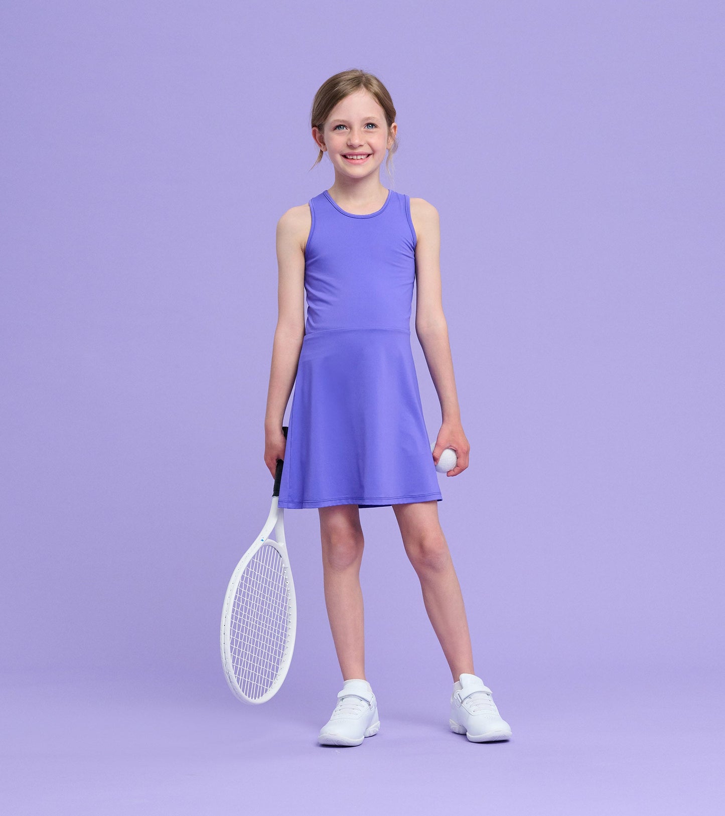 Purple active A-line dress with a sleeveless design, worn by a girl holding a tennis racket and ball.