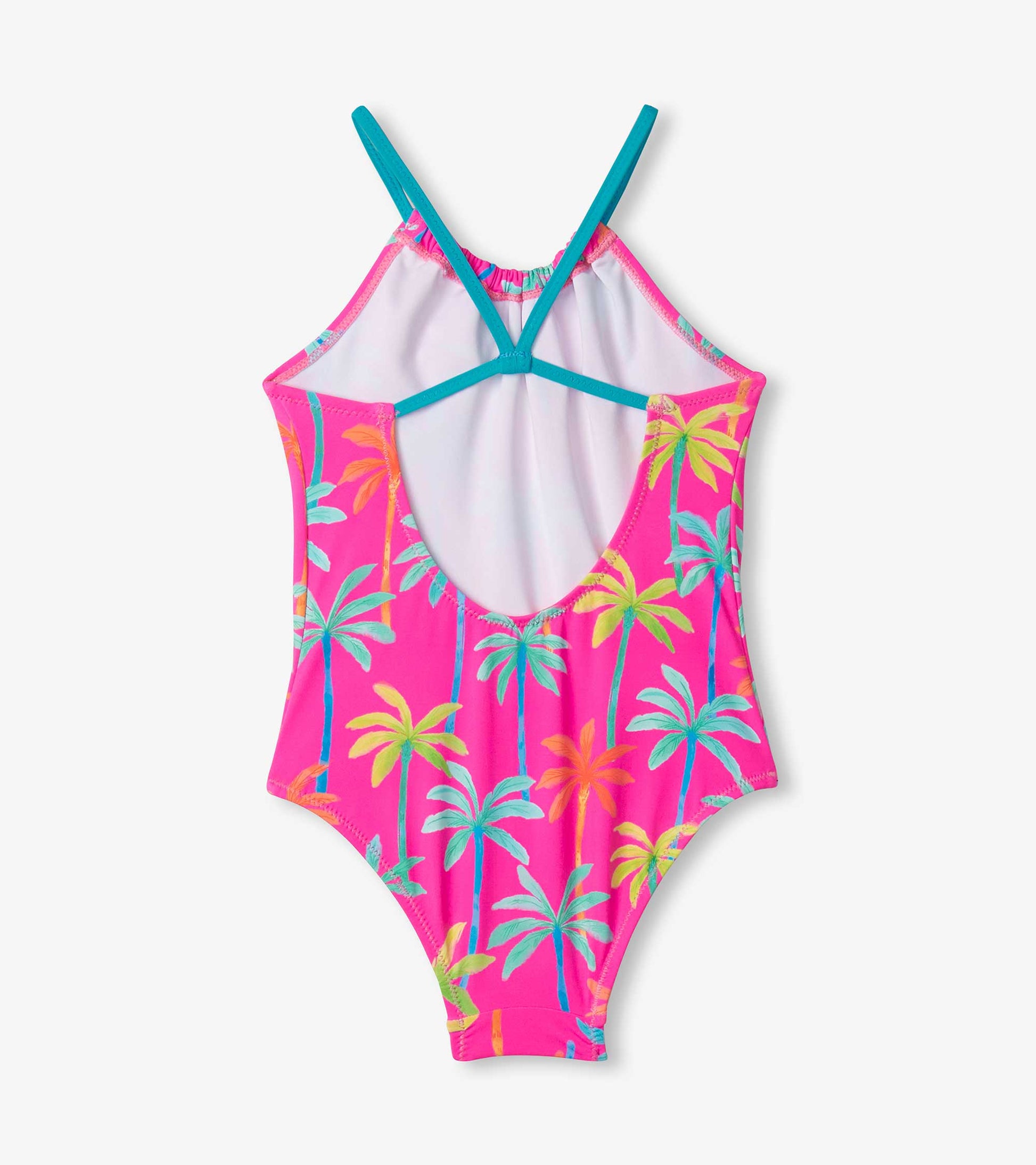 Bright pink swimsuit with colorful palm tree print, featuring a gathered front and crossback straps.