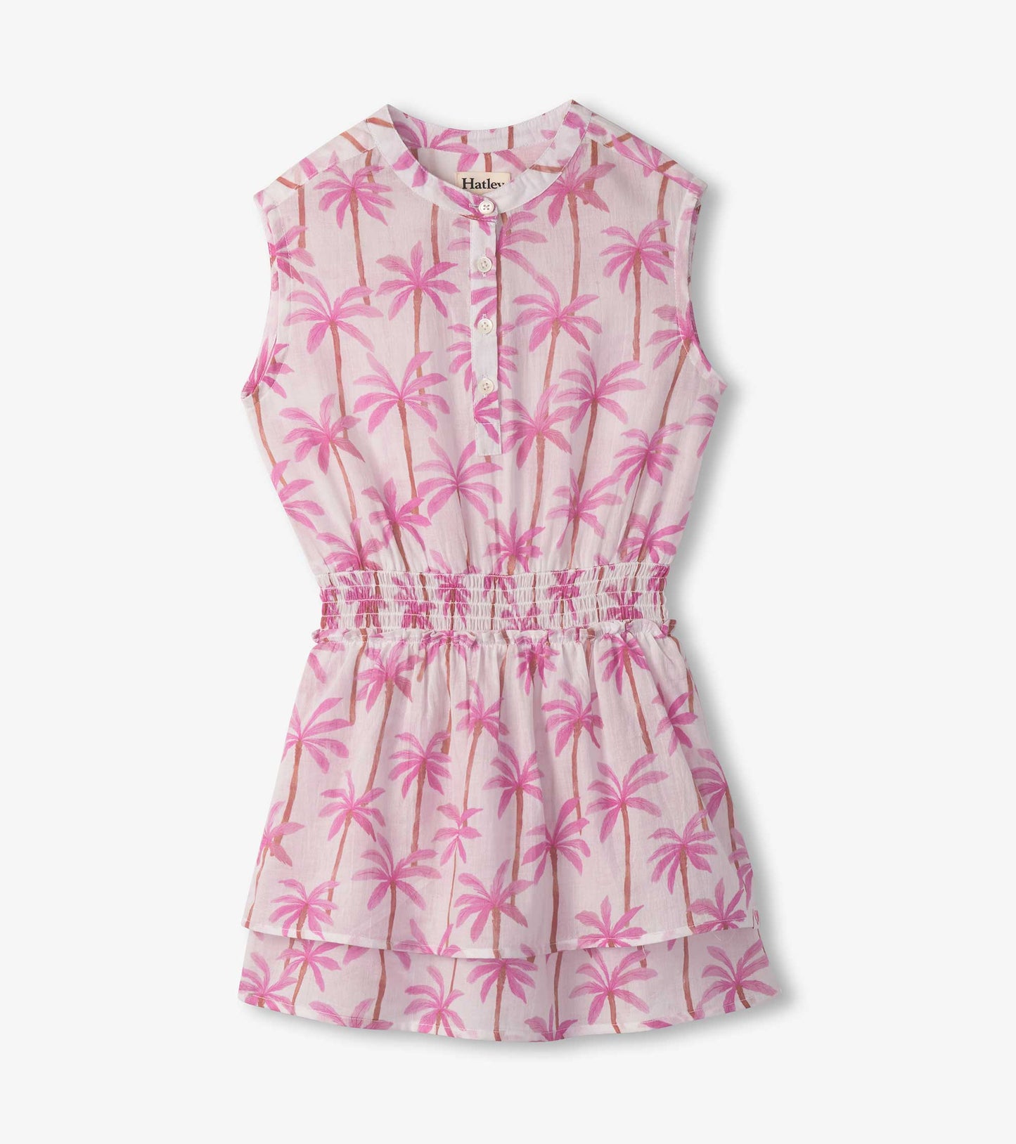 Light pink dress with palm tree print, smocked waist, and sleeveless design.