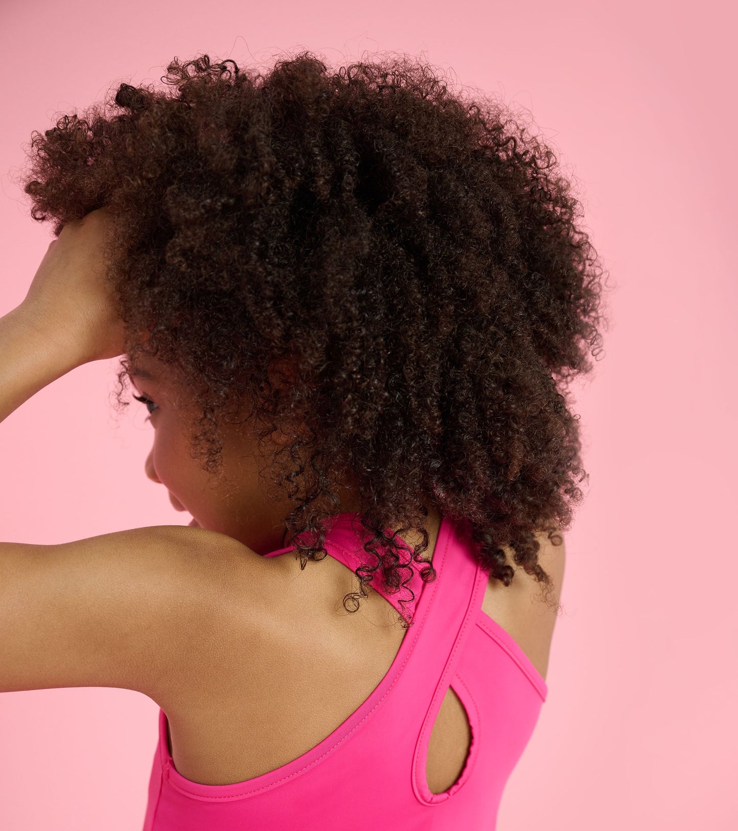 Bright pink A-line dress with a racerback design, perfect for active play.