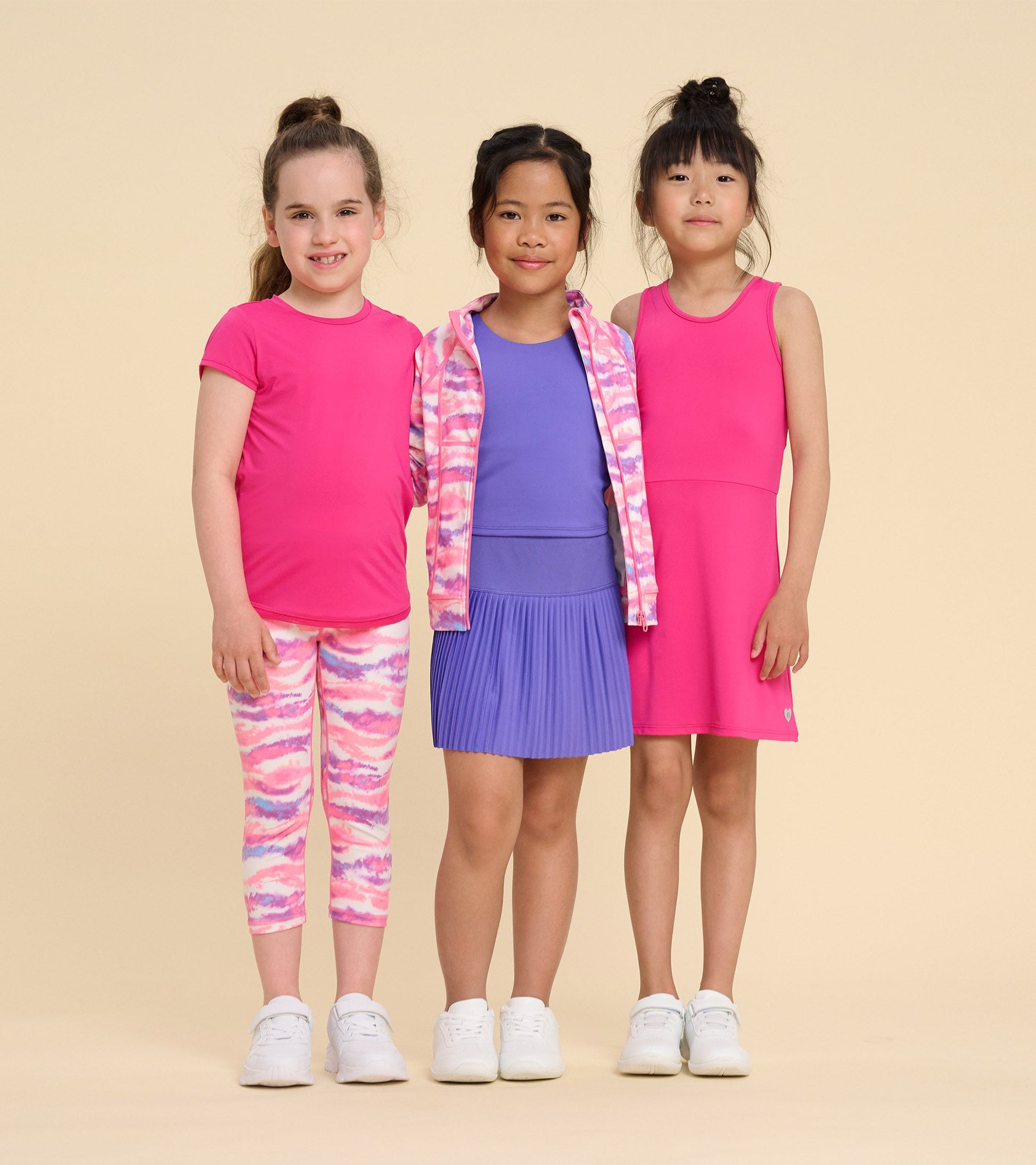 Girls' pink active A-line dress, sleeveless design, paired with colorful leggings and tops, suitable for active play.