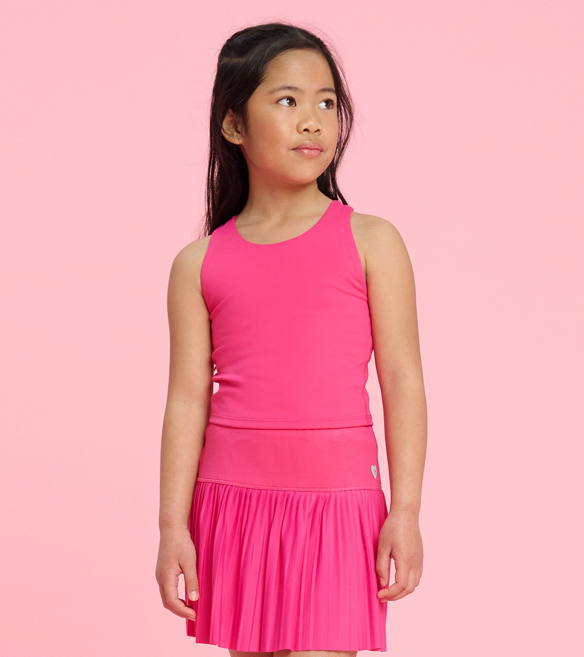 Bright pink tank top with a fitted design, perfect for casual wear or active play.