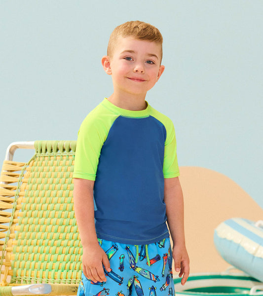 Short sleeve rashguard in blue with lime green sleeves, perfect for beach or pool activities.