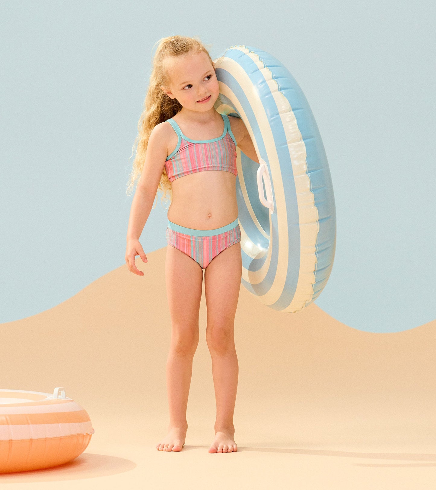 Girls' bikini set featuring a colorful shimmer stripe pattern, with a matching top and bottom, perfect for beachwear.