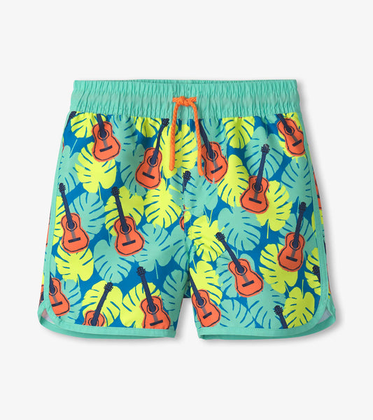 Boys' swim shorts featuring a vibrant tropical pattern with guitars and leaves, elastic waistband with drawstring.