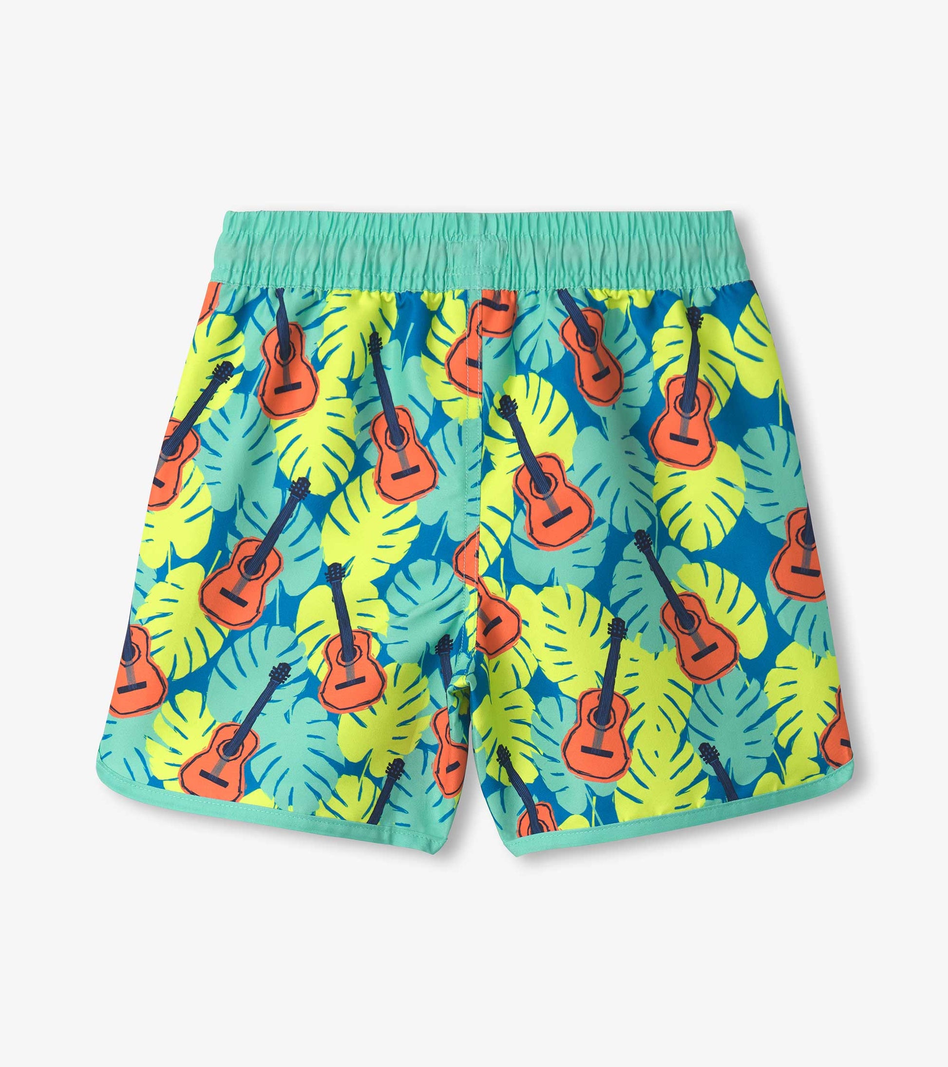 Boys' swim shorts featuring a vibrant tropical guitar and leaf pattern in blue, green, and yellow with an elastic waistband.
