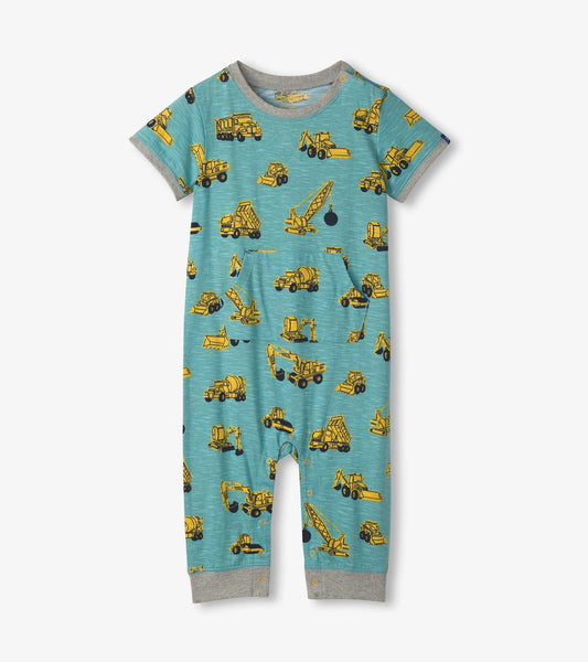 Light blue jersey romper featuring yellow construction vehicle prints, short sleeves, and snap closures at the bottom.