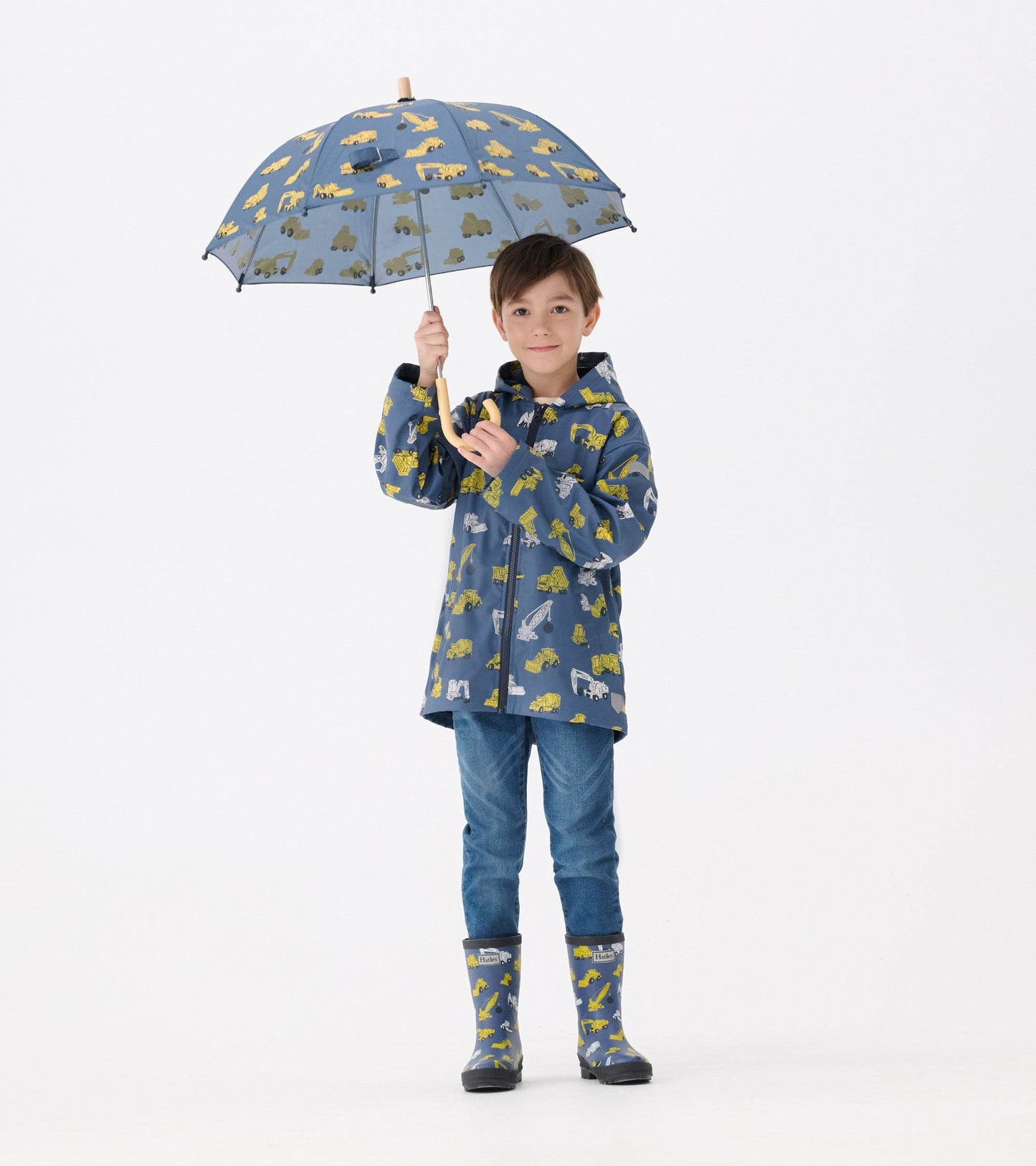 Matte rain boots for boys featuring a construction vehicle pattern, designed for wet weather use.
