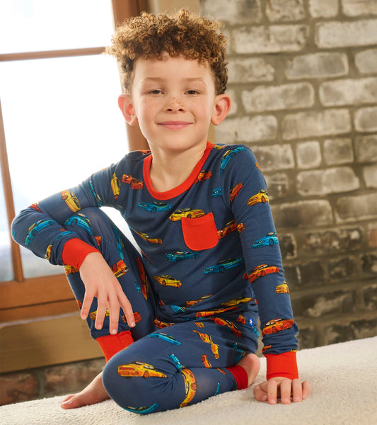 Navy bamboo pajama set for boys featuring colorful car prints and red accents, ideal for sleepwear or lounging.