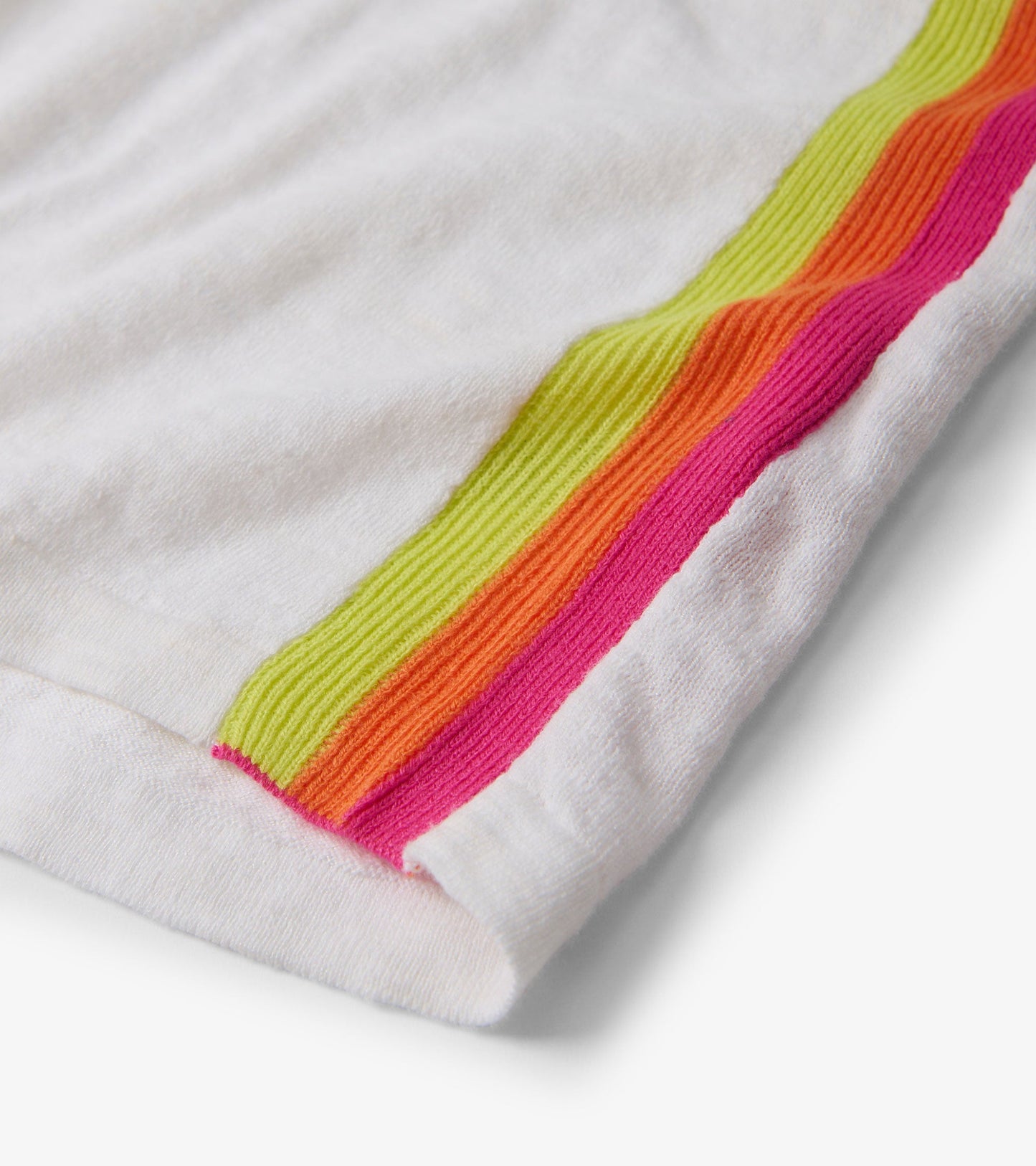 White V-neck knit tee featuring colorful ribbed stripes in pink, orange, and green along the hem.