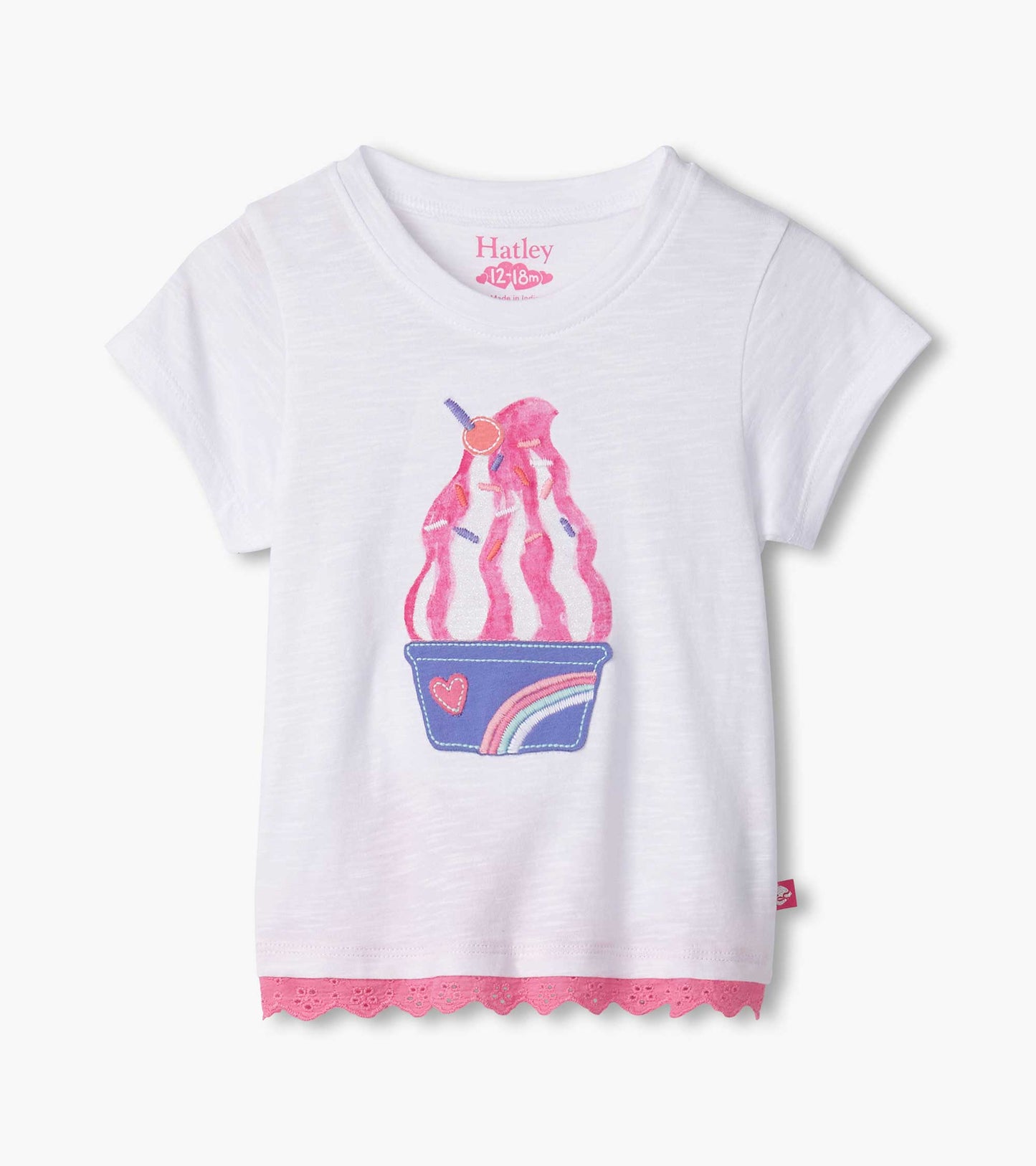 White short-sleeve t-shirt featuring a colorful ice cream sundae graphic and pink eyelet trim at the hem.