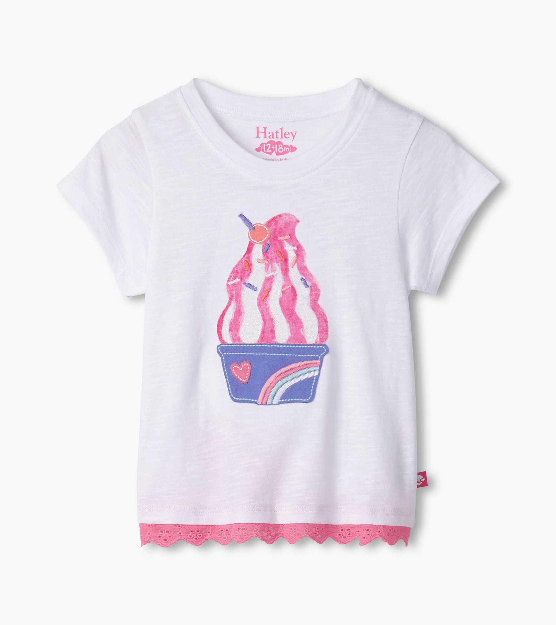White short-sleeve t-shirt featuring a colorful ice cream sundae graphic and pink eyelet trim at the hem.