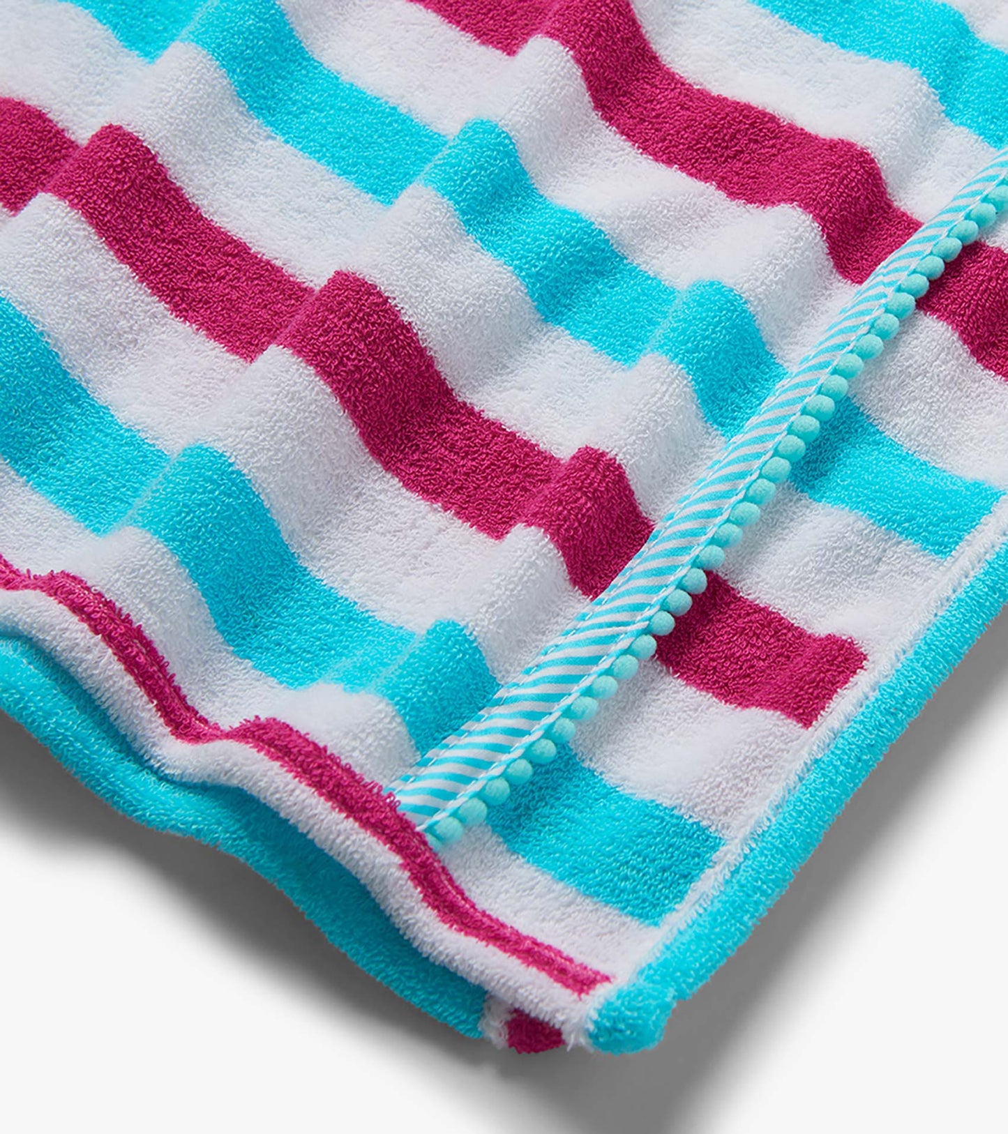 Close-up of a terry hooded cover-up with turquoise, white, and magenta zigzag stripes and striped trim.