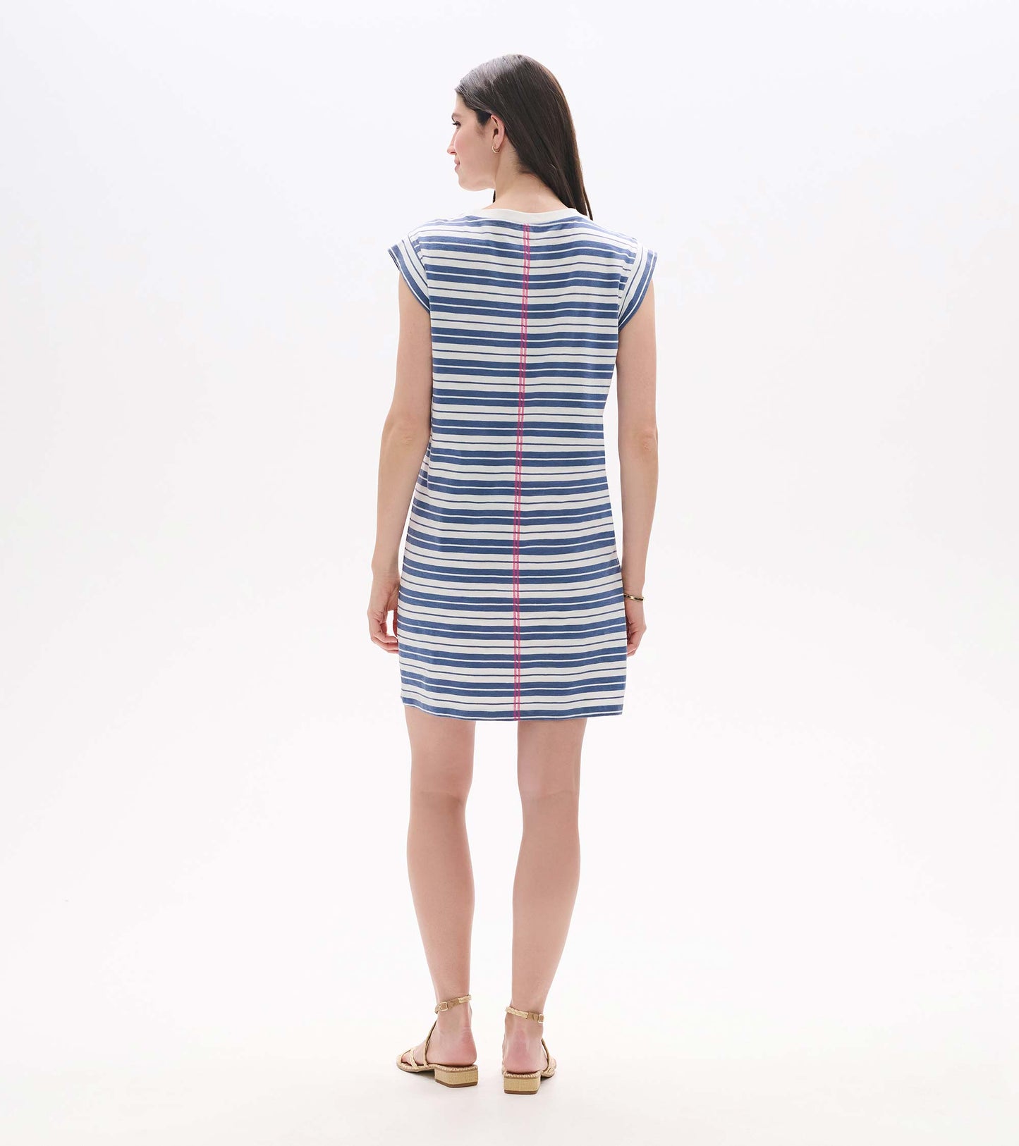 Back view of a blue and white striped short-sleeve T-shirt dress with pink center seam detail.