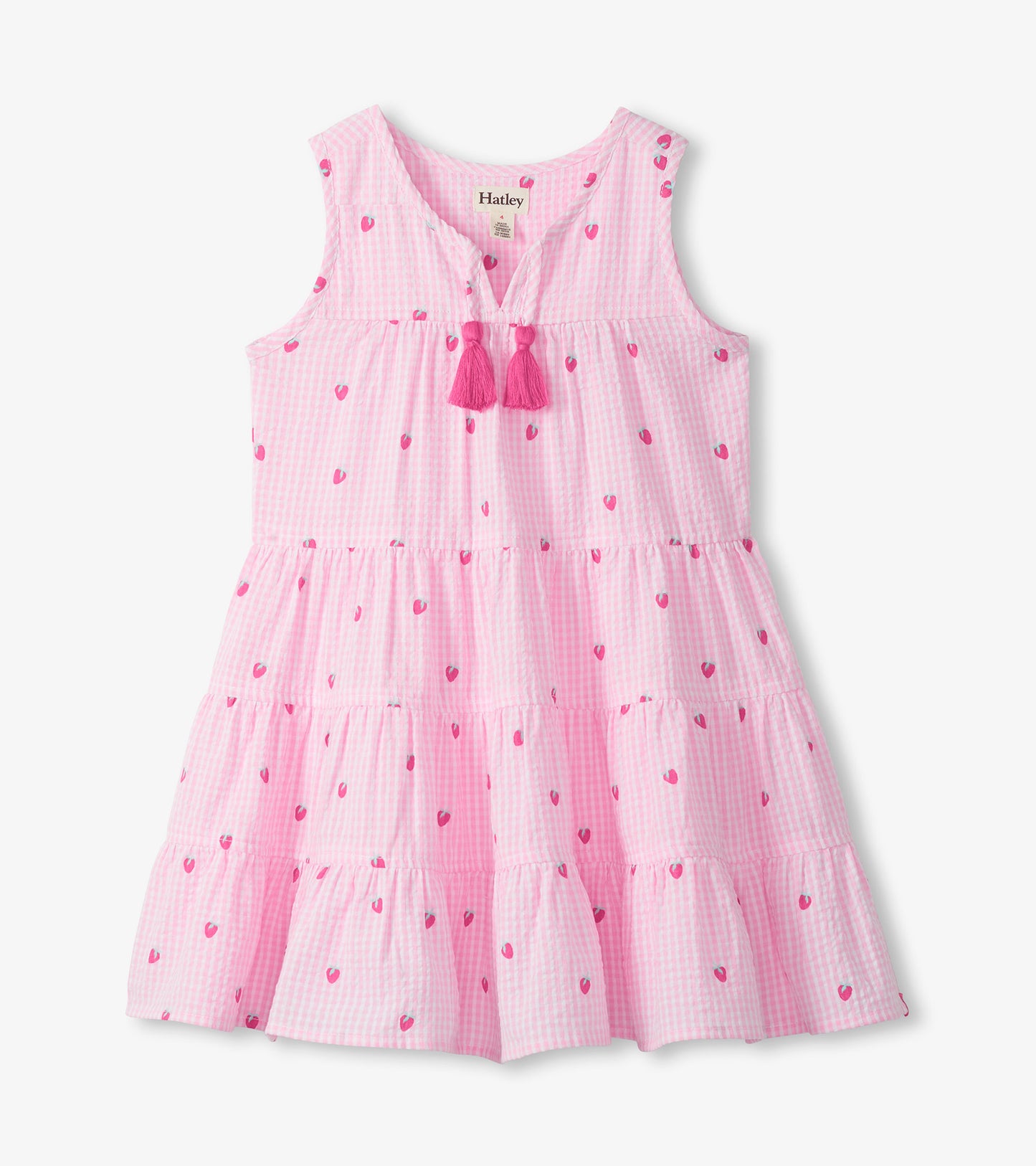 Pink gingham sleeveless tiered dress with small berry print, split neckline, and tassel ties