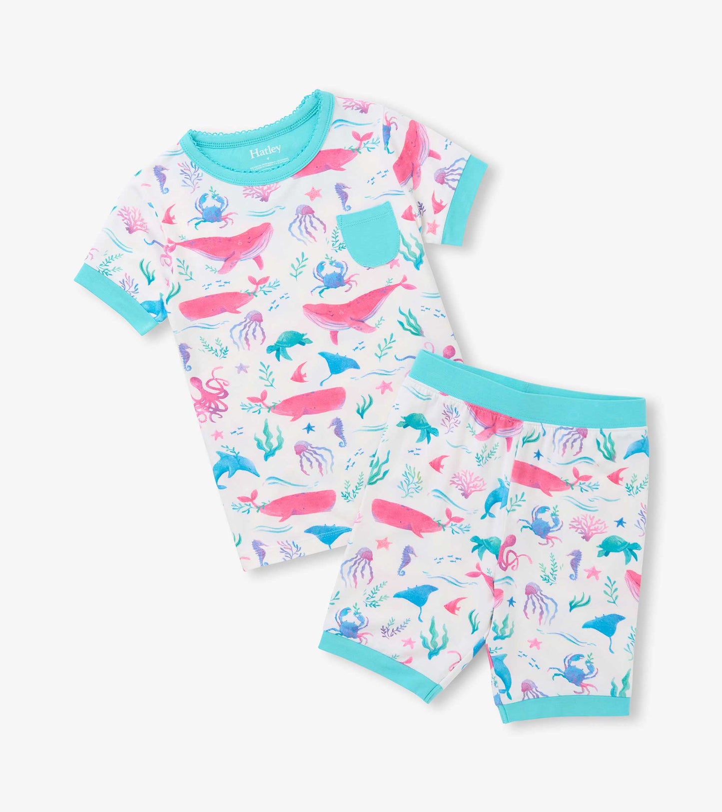 Two-piece girls pajama set with pastel sea life print, aqua trim, short sleeves, shorts, and chest pocket