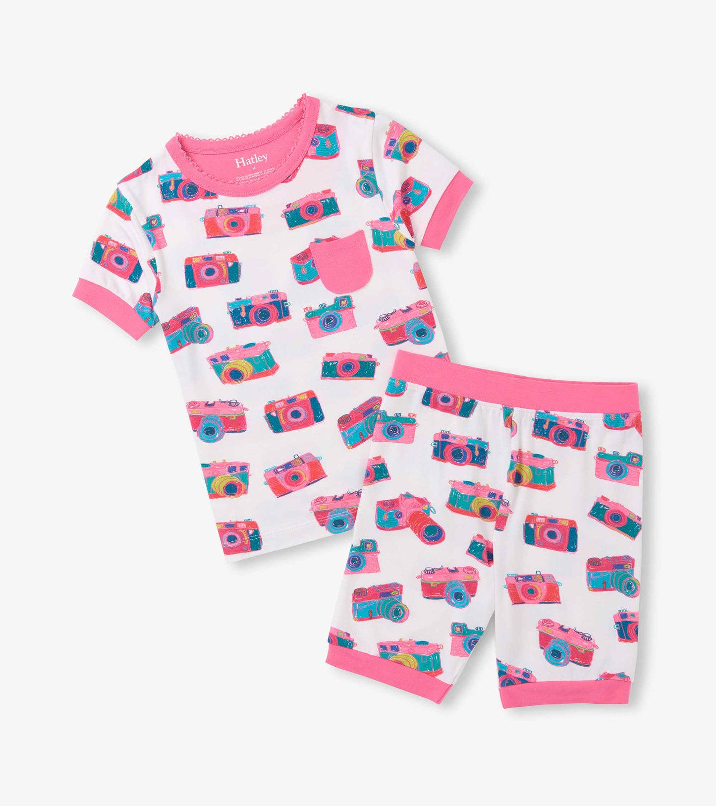 Girls short pajama set with white background, pink trim, chest pocket, and colorful sketch camera print