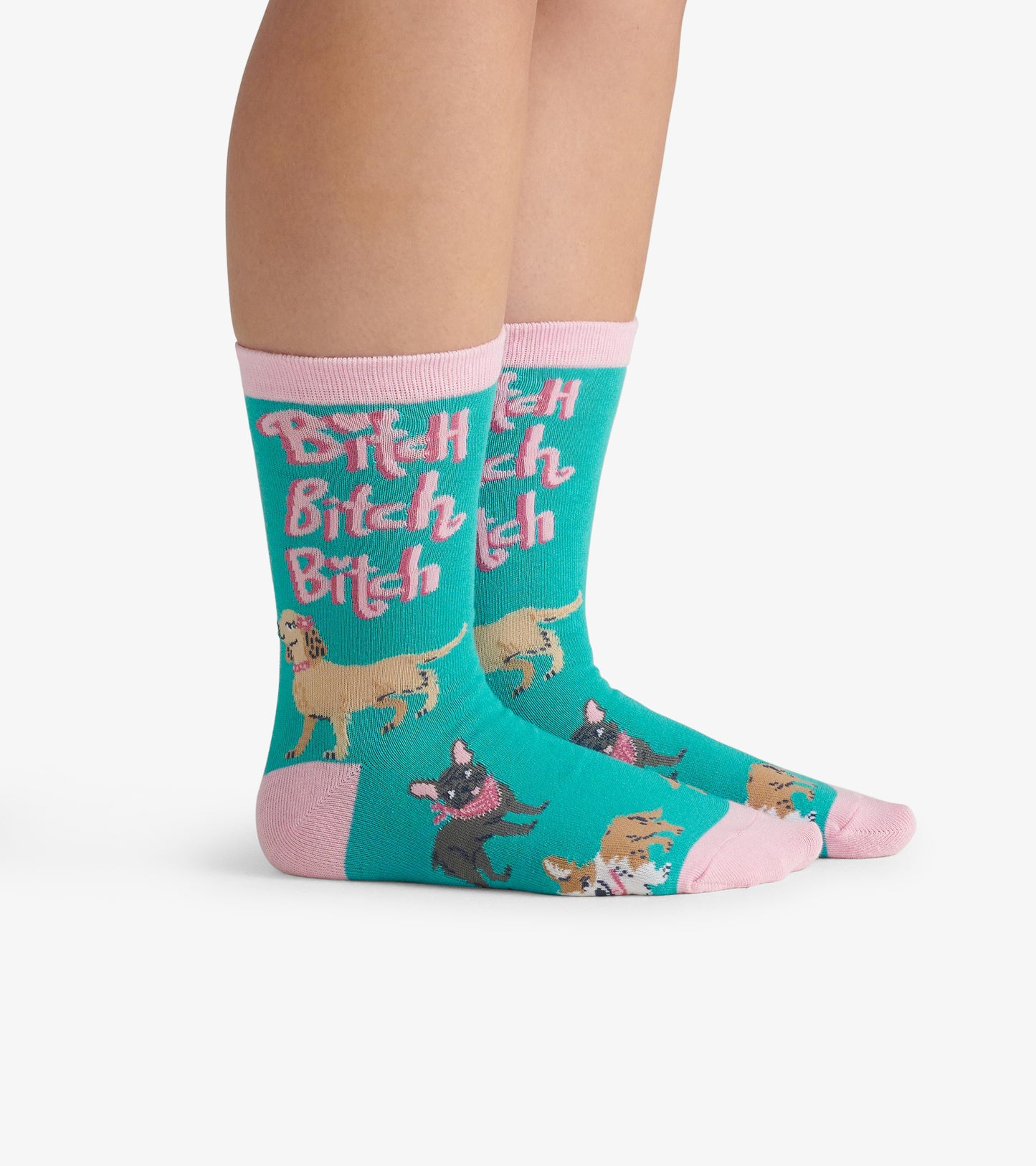 Turquoise crew socks featuring playful dog illustrations and the repeated text "Bitch" in pink. One size fits most.