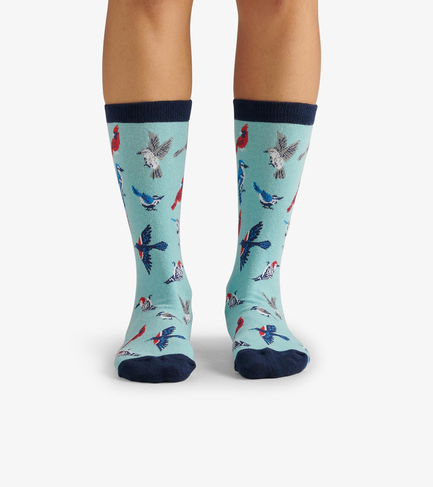 Light blue crew socks featuring colorful bird patterns and a navy cuff, suitable for casual wear.