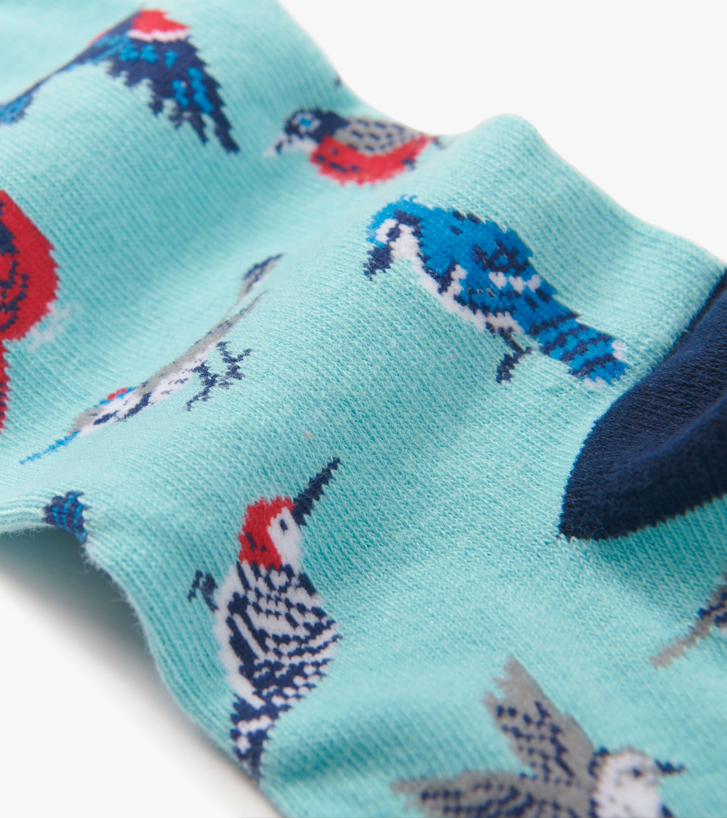 Light blue crew socks featuring colorful bird patterns, made from soft material, suitable for casual wear.
