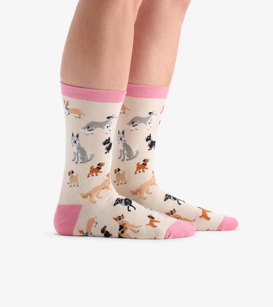 Beige crew socks featuring a playful dog pattern with pink accents at the cuff and toe. One size fits most.
