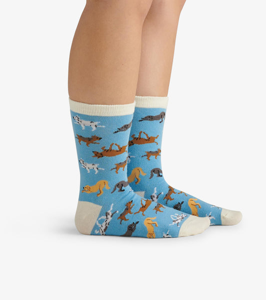 Blue crew socks featuring playful dog patterns, with a cream cuff and toe, suitable for casual wear.