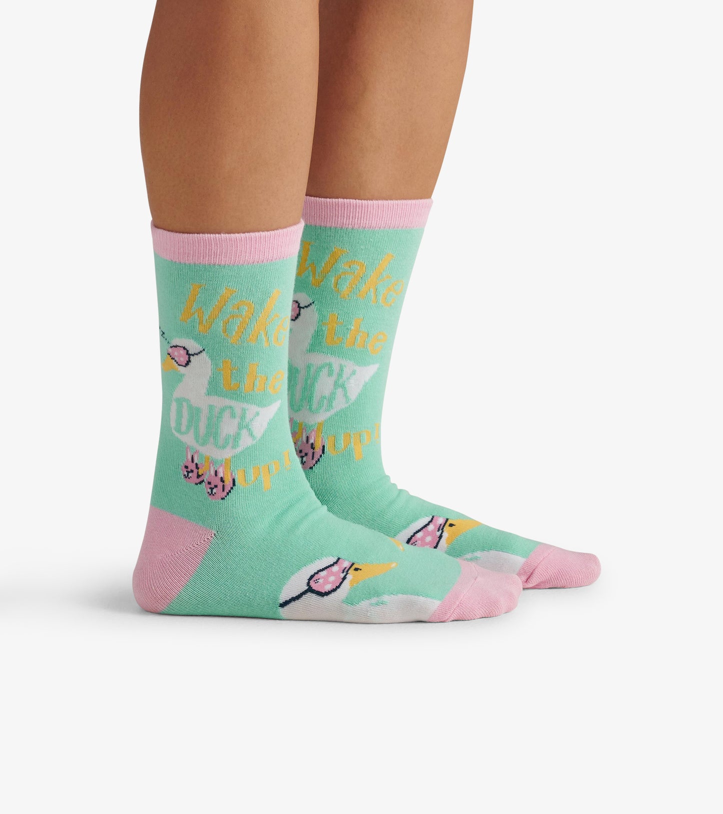 Mint green crew socks with pink accents, featuring a duck graphic and playful text design. One size fits most.