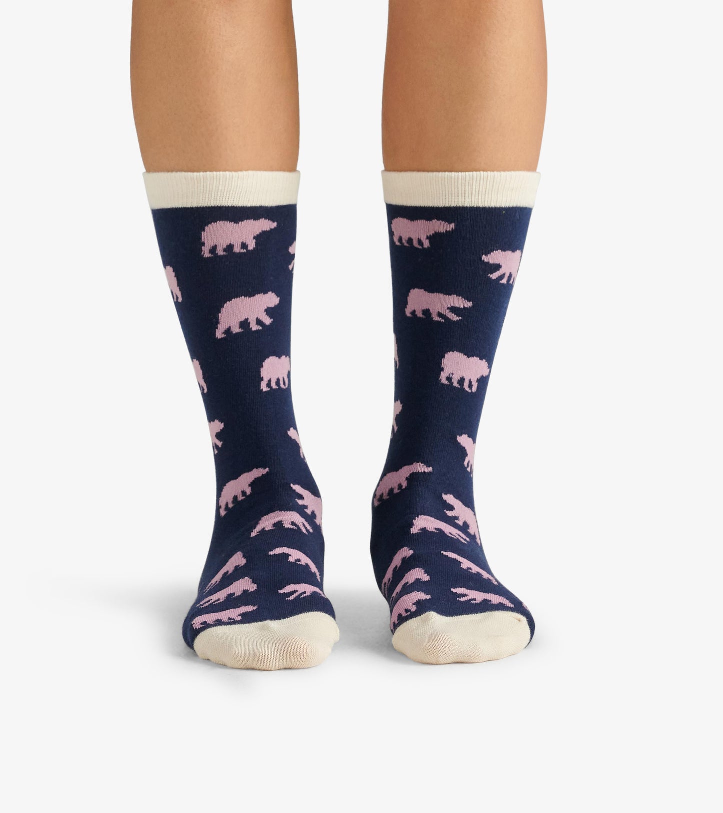 Navy crew socks featuring pink bear patterns and a cream-colored cuff, suitable for casual wear.