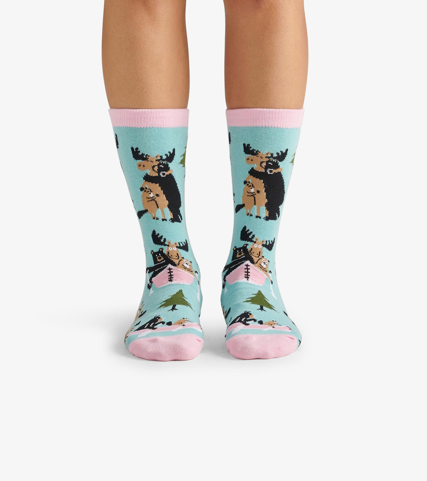 Light blue crew socks featuring moose and trees, with pink cuffs and toes, suitable for casual wear.