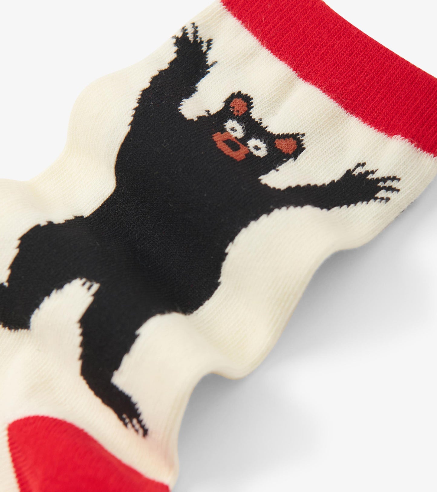 Cream crew socks featuring a playful black bear design with red accents at the top. One size fits all.