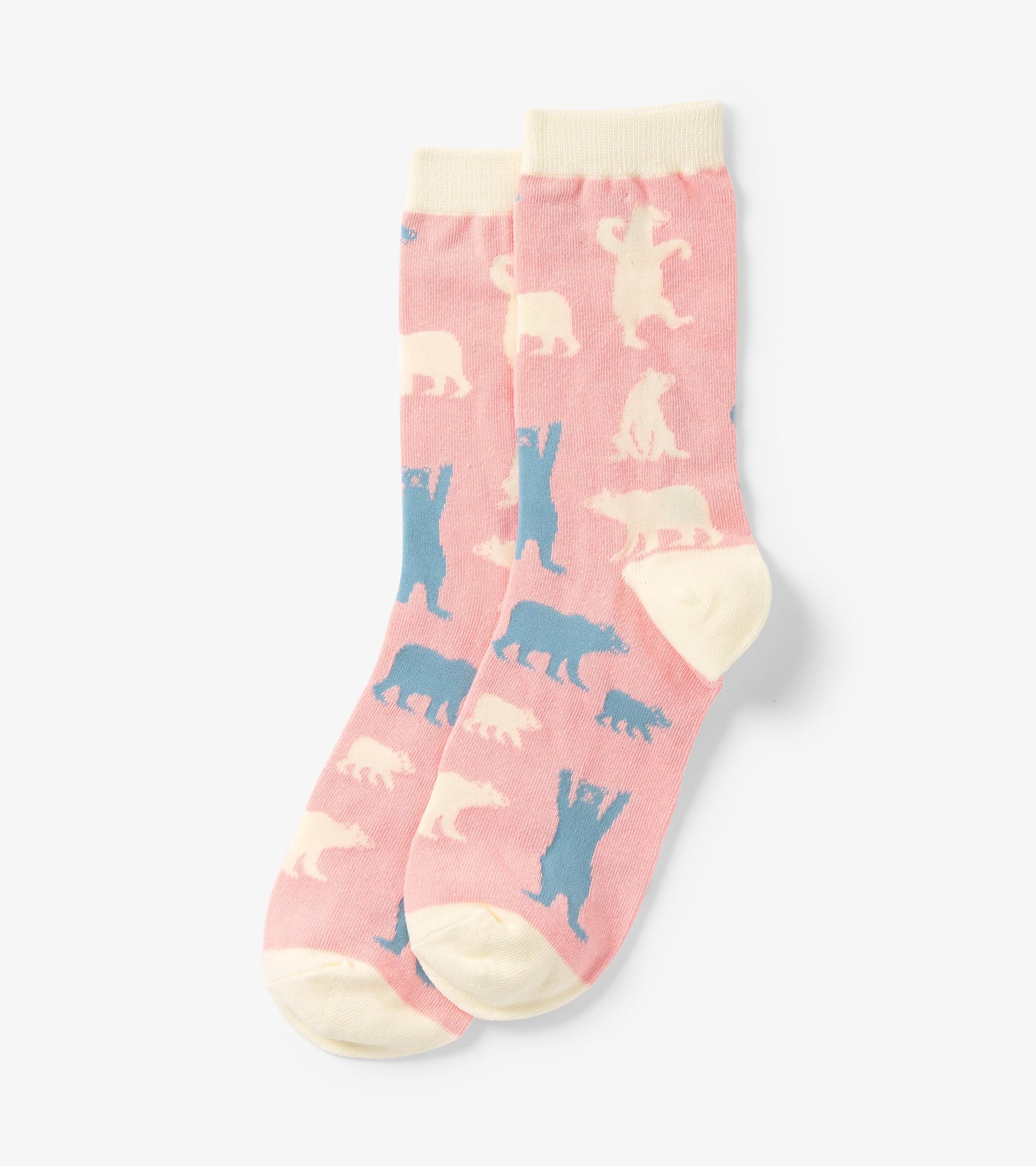Pink crew socks featuring playful polar bear patterns in blue and cream, with a contrasting cream cuff and toe.