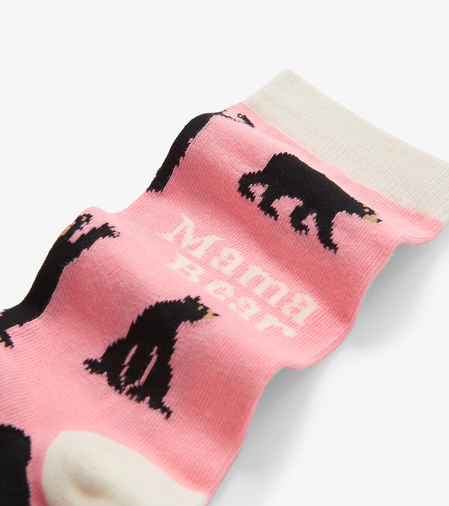 Pink crew socks featuring black bear graphics and "Mama Bear" text, with a contrasting cream cuff.