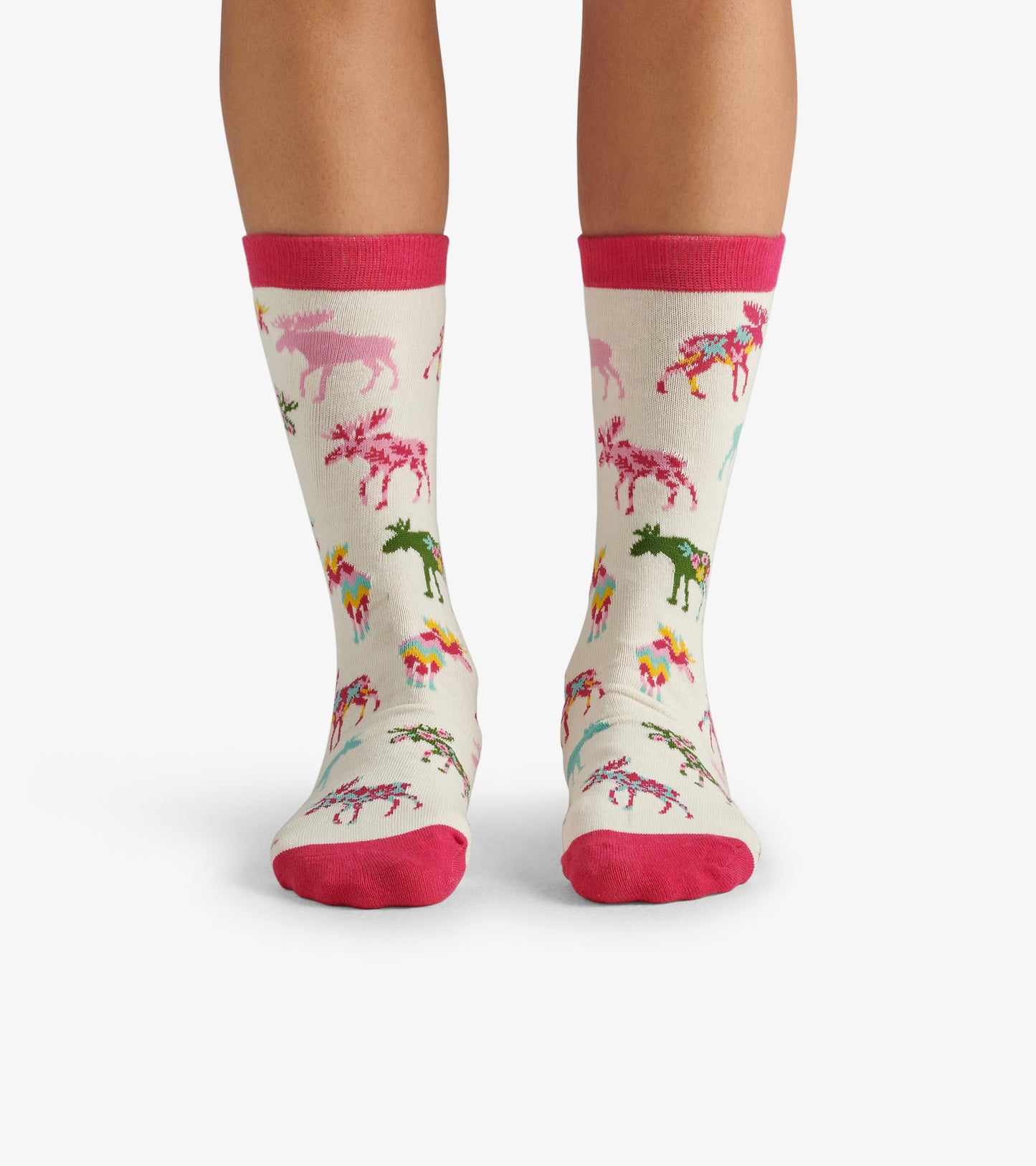 Cream crew socks featuring colorful moose and floral patterns, with pink cuffs and toes. One size fits most.