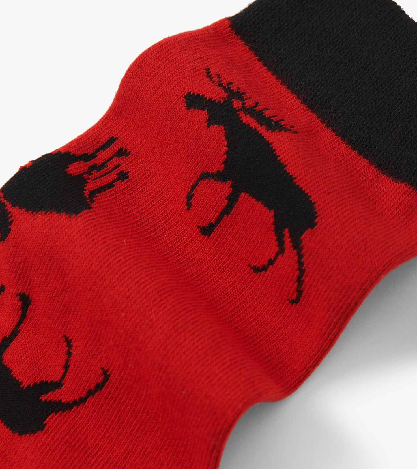 Red women's crew socks featuring black moose patterns and a black cuff. Suitable for casual wear.