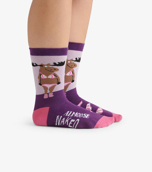 Purple crew socks featuring a moose graphic in a bikini, with pink accents and the word "NAKED" on the toe.
